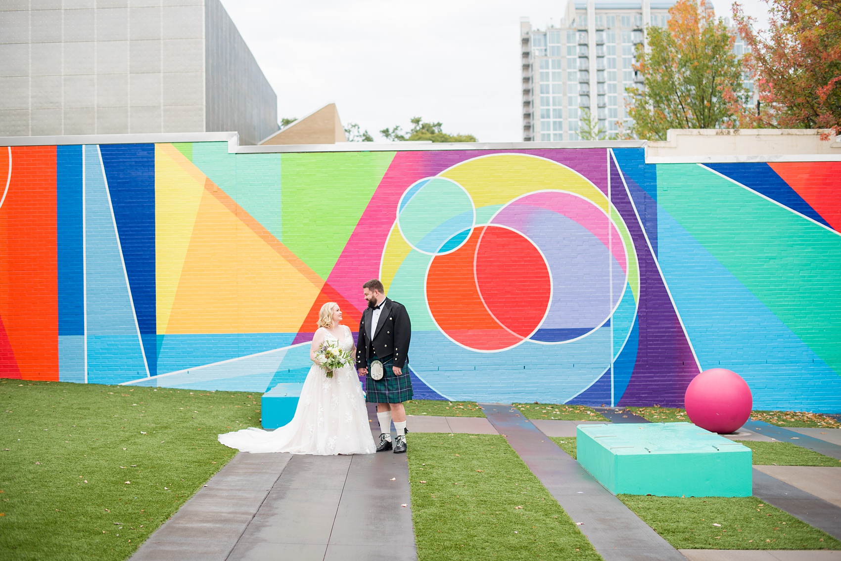 Mikkel Paige Photography captures a beautiful bride + groom during their fall wedding in Downtown Raleigh, North Carolina. All Saints Chapel was their ceremony + reception venue, which they decorated with gold + silver decor and autumn centerpieces. Couple portraits were taken outdoors and the fun event continued inside the unique, historic venue. Click through for all the details from this amazing celebration! #MikkelPaige #RaleighWeddingPhotographer #RaleighWeddingVenue #DowntownRaleighWedding