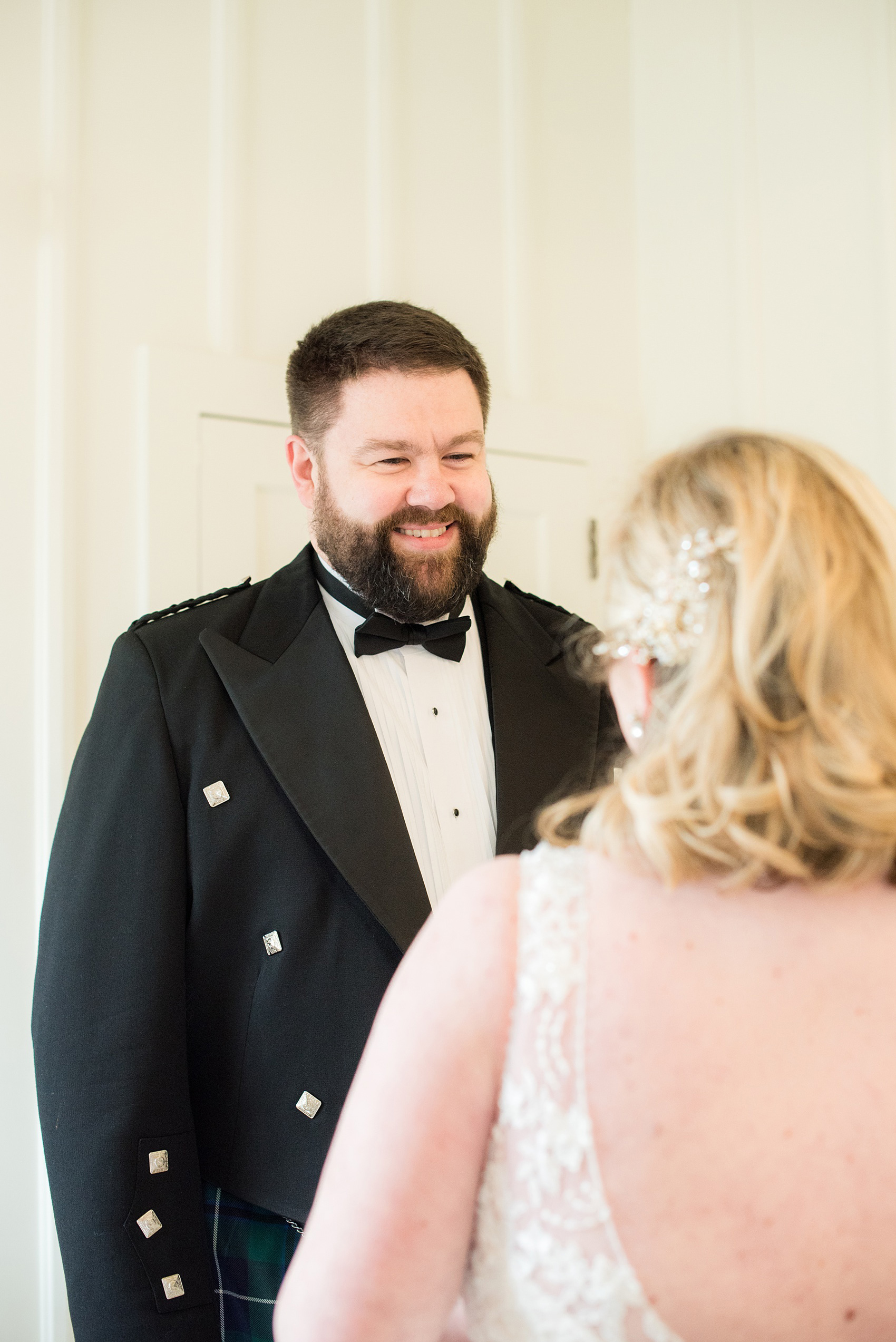 Mikkel Paige Photography captures a beautiful bride + groom during their fall wedding in Downtown Raleigh, North Carolina. All Saints Chapel was their ceremony + reception venue, which they decorated with gold + silver decor and autumn centerpieces. Couple portraits were taken outdoors and the fun event continued inside the unique, historic venue. Click through for all the details from this amazing celebration! #MikkelPaige #RaleighWeddingPhotographer #RaleighWeddingVenue #DowntownRaleighWedding