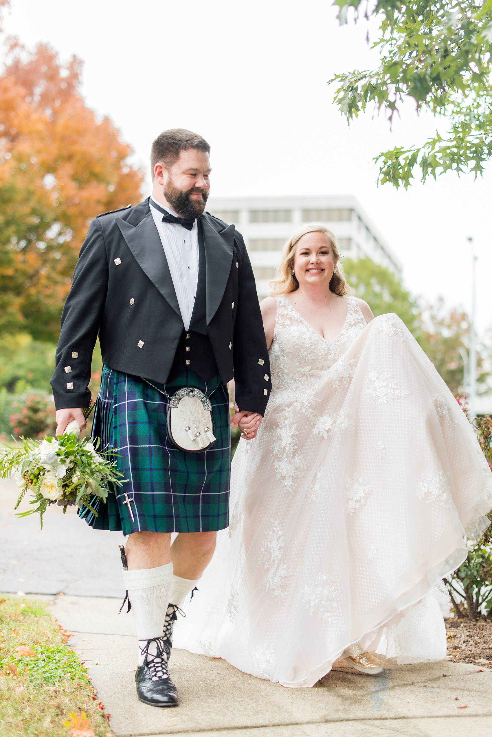 Mikkel Paige Photography captures a beautiful bride + groom during their fall wedding in Downtown Raleigh, North Carolina. All Saints Chapel was their ceremony + reception venue, which they decorated with gold + silver decor and autumn centerpieces. Couple portraits were taken outdoors and the fun event continued inside the unique, historic venue. Click through for all the details from this amazing celebration! #MikkelPaige #RaleighWeddingPhotographer #RaleighWeddingVenue #DowntownRaleighWedding