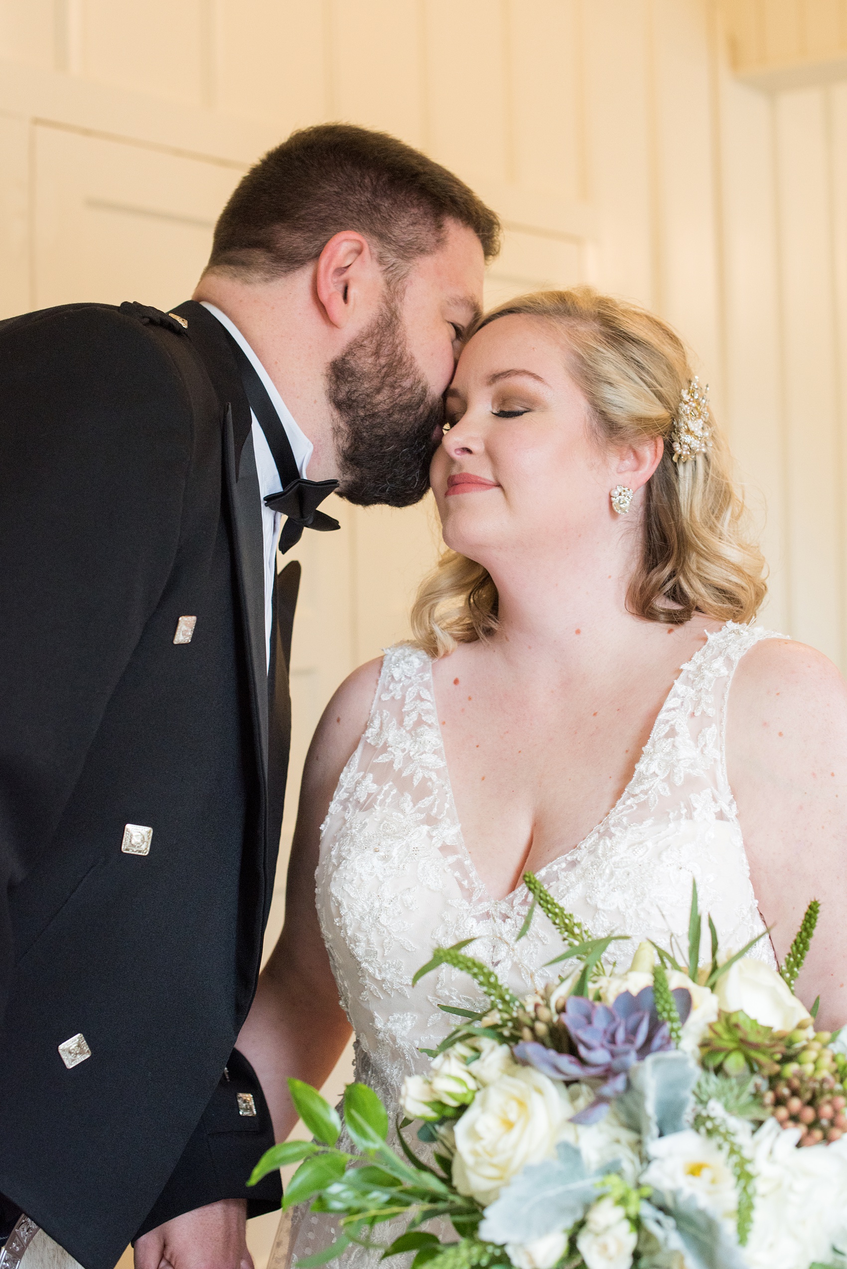 Mikkel Paige Photography captures a beautiful bride + groom during their fall wedding in Downtown Raleigh, North Carolina. All Saints Chapel was their ceremony + reception venue, which they decorated with gold + silver decor and autumn centerpieces. Couple portraits were taken outdoors and the fun event continued inside the unique, historic venue. Click through for all the details from this amazing celebration! #MikkelPaige #RaleighWeddingPhotographer #RaleighWeddingVenue #DowntownRaleighWedding