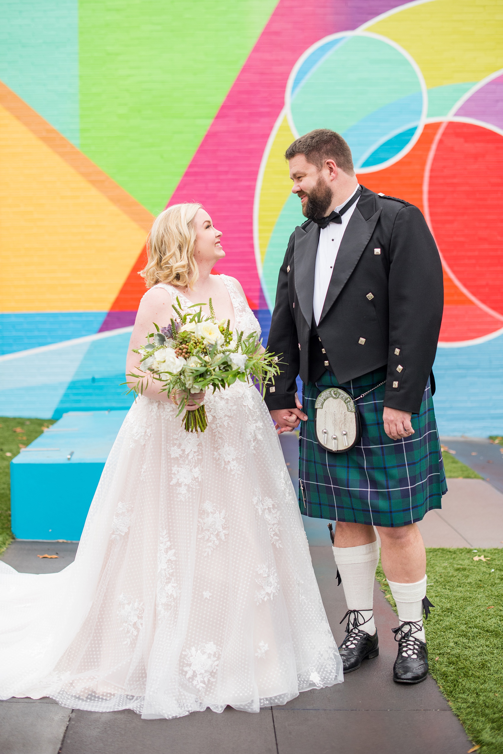 Mikkel Paige Photography captures a beautiful bride + groom during their fall wedding in Downtown Raleigh, North Carolina. All Saints Chapel was their ceremony + reception venue, which they decorated with gold + silver decor and autumn centerpieces. Couple portraits were taken outdoors and the fun event continued inside the unique, historic venue. Click through for all the details from this amazing celebration! #MikkelPaige #RaleighWeddingPhotographer #RaleighWeddingVenue #DowntownRaleighWedding