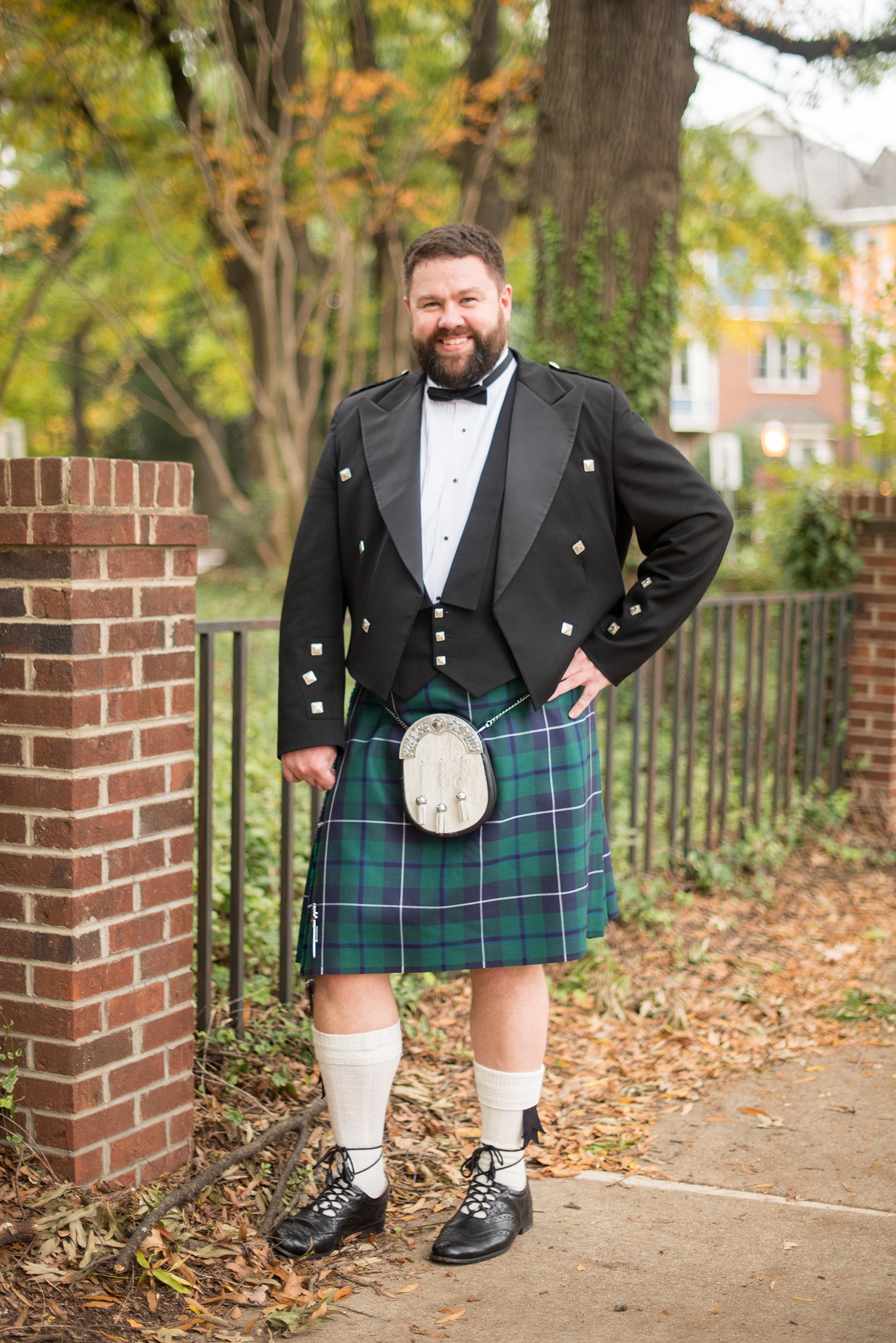 Mikkel Paige Photography captures beautiful groom portraits and his blue + green tartan, Scottish kilt in Downtown Raleigh, North Carolina. Couple portraits were taken outdoors and the fun event continued inside the unique, historic venue. Click through for all the details from this unique celebration! #MikkelPaige #RaleighWeddingPhotographer #RaleighWeddingVenue #DowntownRaleighWedding #Groom #Kilt #ScottishGroom