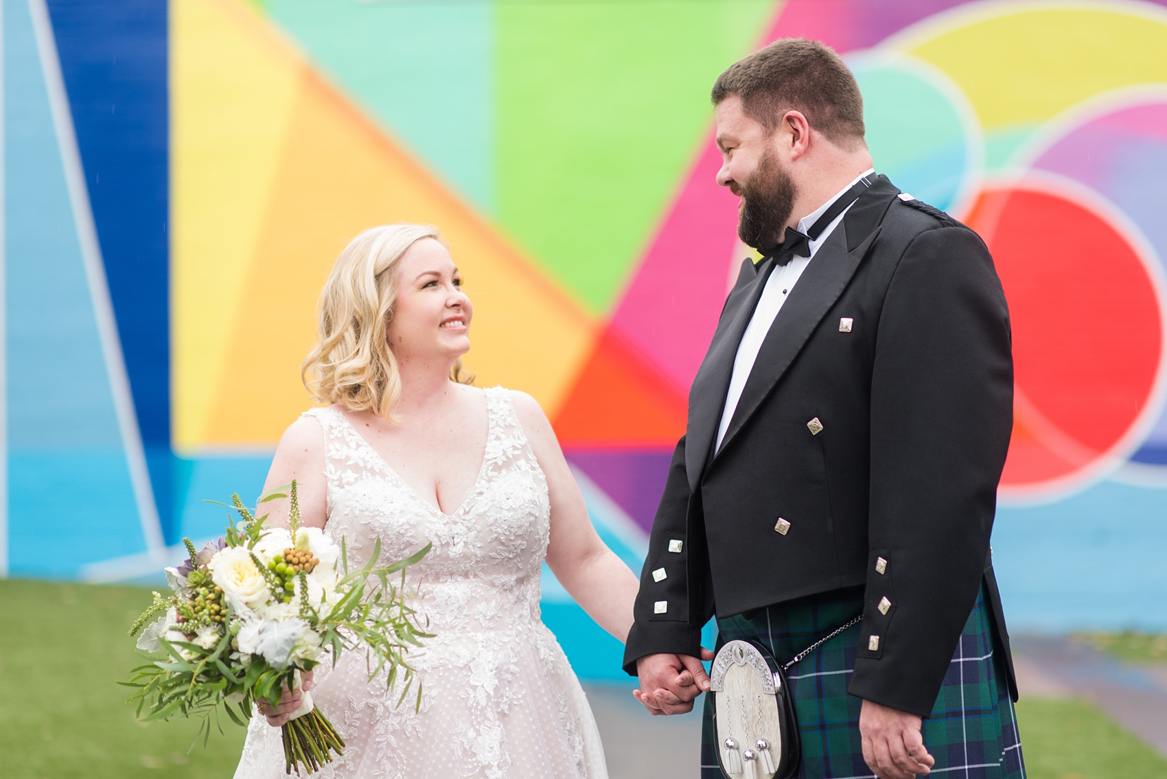 Mikkel Paige Photography captures a beautiful bride + groom during their fall wedding in Downtown Raleigh, North Carolina. All Saints Chapel was their ceremony + reception venue, which they decorated with gold + silver decor and autumn centerpieces. Couple portraits were taken outdoors and the fun event continued inside the unique, historic venue. Click through for all the details from this amazing celebration! #MikkelPaige #RaleighWeddingPhotographer #RaleighWeddingVenue #DowntownRaleighWedding