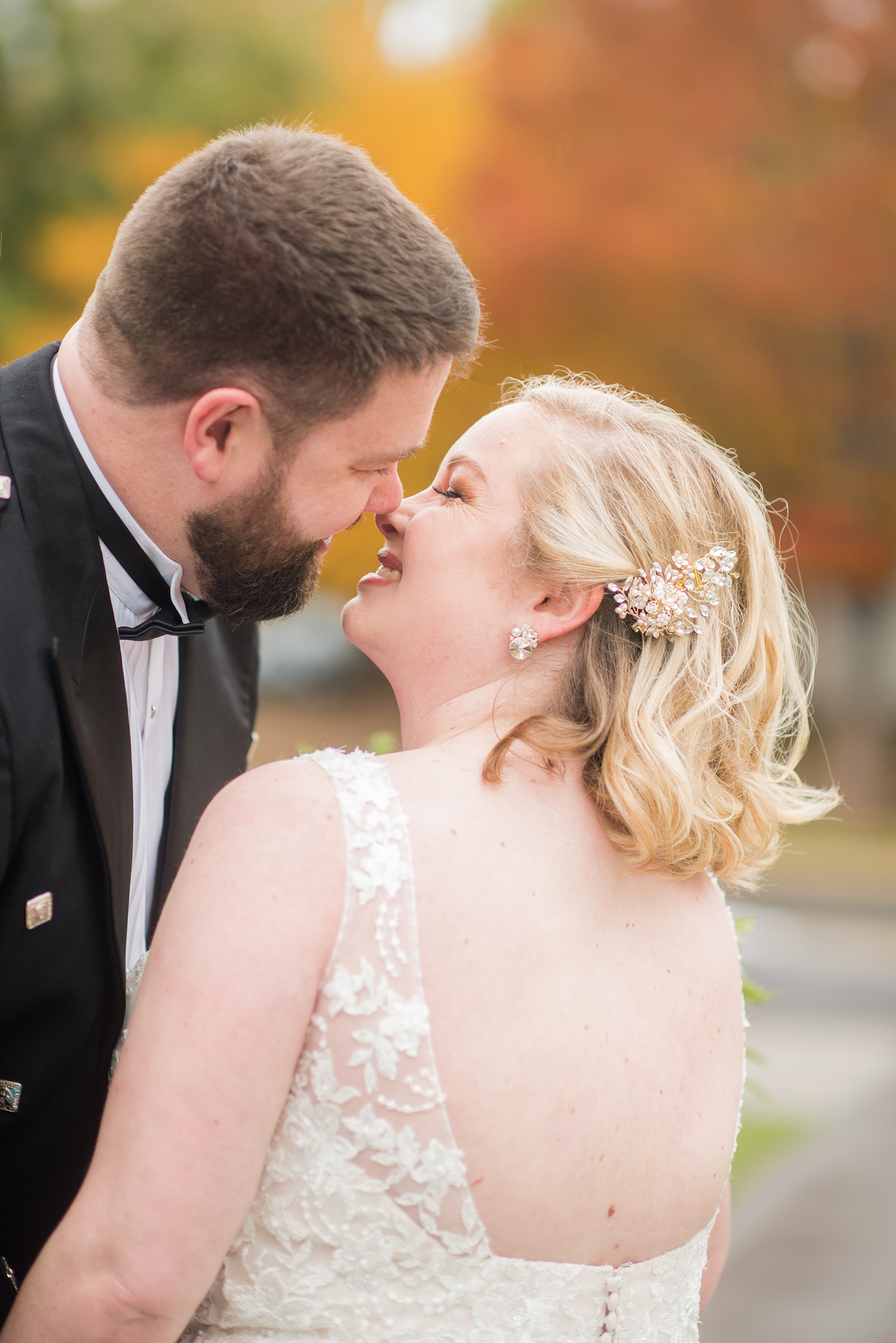 Mikkel Paige Photography captures a beautiful bride + groom during their fall wedding in Downtown Raleigh, North Carolina. All Saints Chapel was their ceremony + reception venue, which they decorated with gold + silver decor and autumn centerpieces. Couple portraits were taken outdoors and the fun event continued inside the unique, historic venue. Click through for all the details from this amazing celebration! #MikkelPaige #RaleighWeddingPhotographer #RaleighWeddingVenue #DowntownRaleighWedding