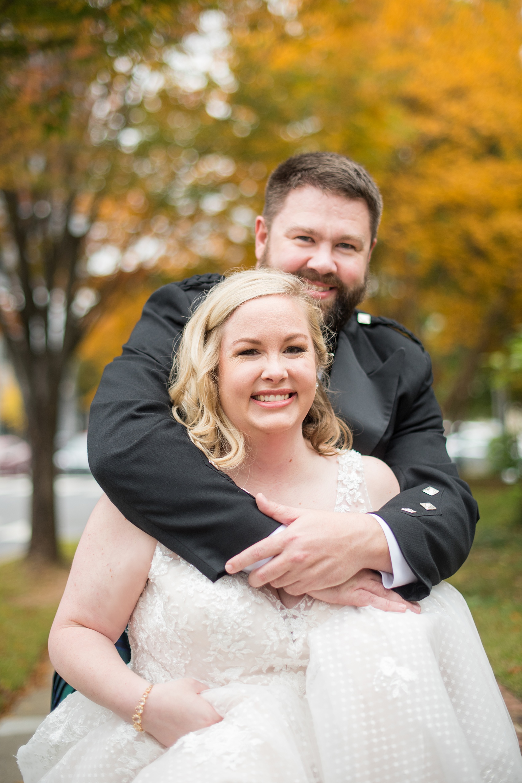 Mikkel Paige Photography captures a beautiful bride + groom during their fall wedding in Downtown Raleigh, North Carolina. All Saints Chapel was their ceremony + reception venue, which they decorated with gold + silver decor and autumn centerpieces. Couple portraits were taken outdoors and the fun event continued inside the unique, historic venue. Click through for all the details from this amazing celebration! #MikkelPaige #RaleighWeddingPhotographer #RaleighWeddingVenue #DowntownRaleighWedding