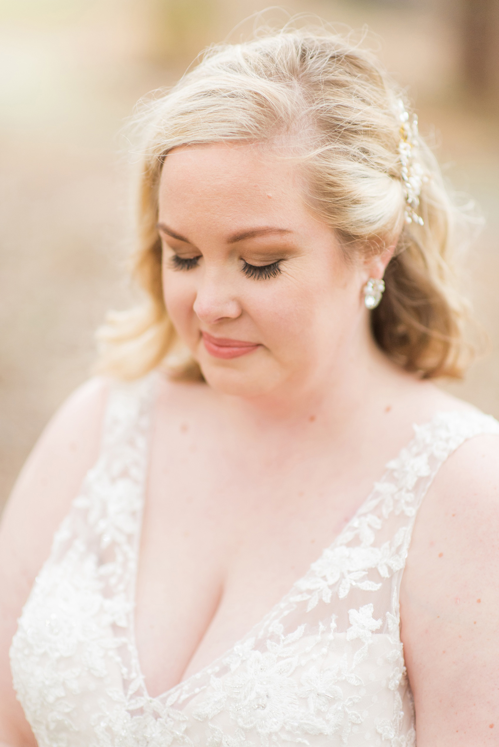 Mikkel Paige Photography captures a beautiful bridal portrait for a fall wedding in Downtown Raleigh, North Carolina. All Saints Chapel was their reception venue that they decorated with gold and silver decor and autumn centerpieces. Couple portraits were taken outdoors and the fun event continued inside the unique, and historic venue. Click through for all the details from this amazing celebration! #MikkelPaige #RaleighWeddingPhotographer #RaleighWeddingVenue #DowntownRaleighWedding