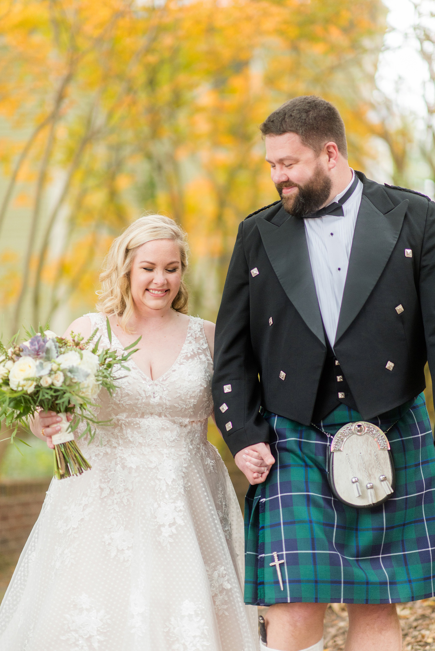 Mikkel Paige Photography captures a beautiful bride + groom during their fall wedding in Downtown Raleigh, North Carolina. All Saints Chapel was their ceremony + reception venue, which they decorated with gold + silver decor and autumn centerpieces. Couple portraits were taken outdoors and the fun event continued inside the unique, historic venue. Click through for all the details from this amazing celebration! #MikkelPaige #RaleighWeddingPhotographer #RaleighWeddingVenue #DowntownRaleighWedding