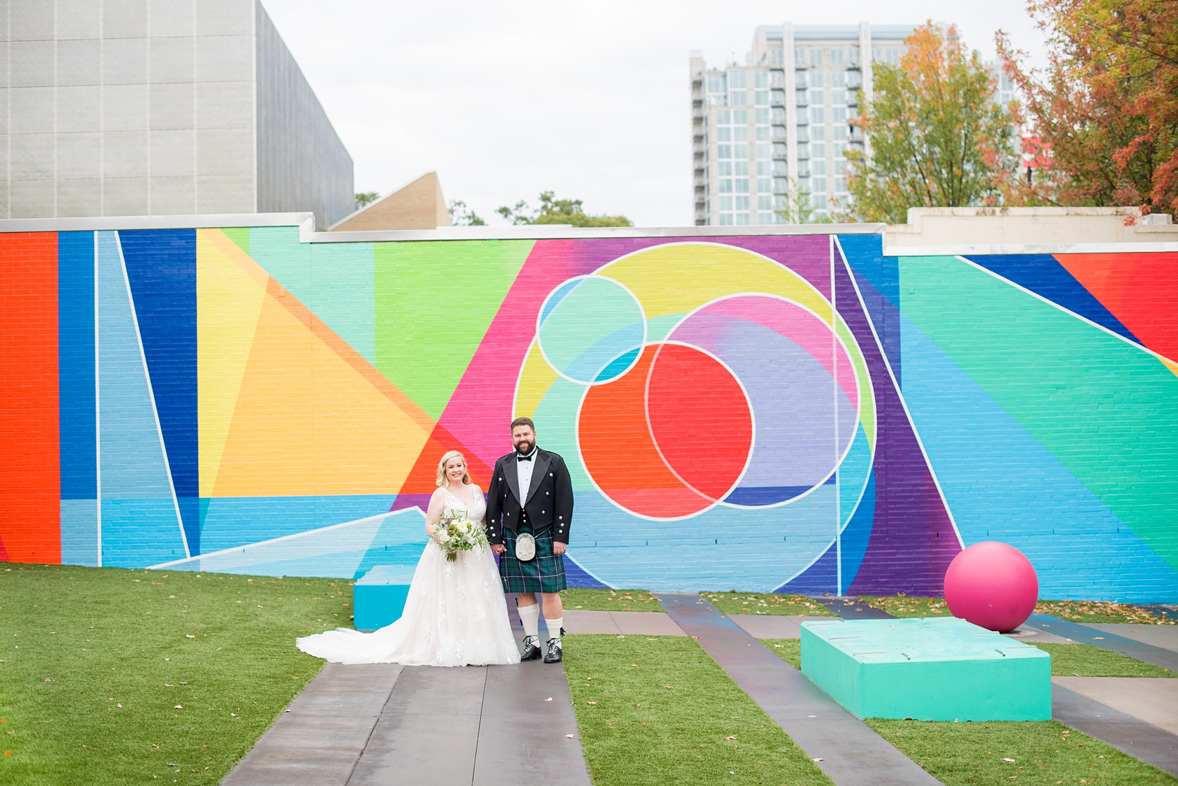 Mikkel Paige Photography captures a beautiful bride + groom during their fall wedding in Downtown Raleigh, North Carolina. All Saints Chapel was their ceremony + reception venue, which they decorated with gold + silver decor and autumn centerpieces. Couple portraits were taken outdoors and the fun event continued inside the unique, historic venue. Click through for all the details from this amazing celebration! #MikkelPaige #RaleighWeddingPhotographer #RaleighWeddingVenue #DowntownRaleighWedding