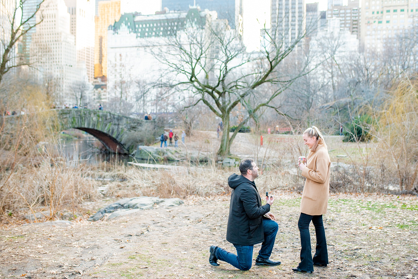 NYC proposal ideas in Central Park with photography by New York City marriage proposal photographer, Mikkel Paige Photography. Of all the cities in the world so many people dream of getting engaged in iconic, beautiful NY. Manhattan is wonderful whether winter, spring, summer, or fall and we're seasoned pros at capturing your moment. Christmas time is magic, Valentine's Day romantic and everyday between can be made memorable! Click through for more grand ideas! #MikkelPaige #NYCproposal #marryme