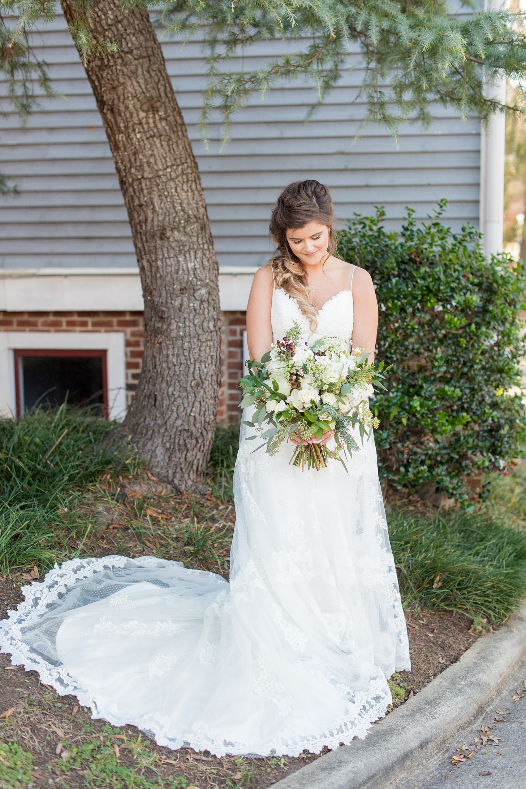 Downtown Raleigh wedding photographer Mikkel Paige Photography captures a December wedding, with evergreen and Christmas touches during the holidays. The reception was held at The Stockroom at 230 and getting ready at The Glass Box. #mikkelpaige #downtownraleighwedding #raleighweddingphotos #raleighweddingphotographer