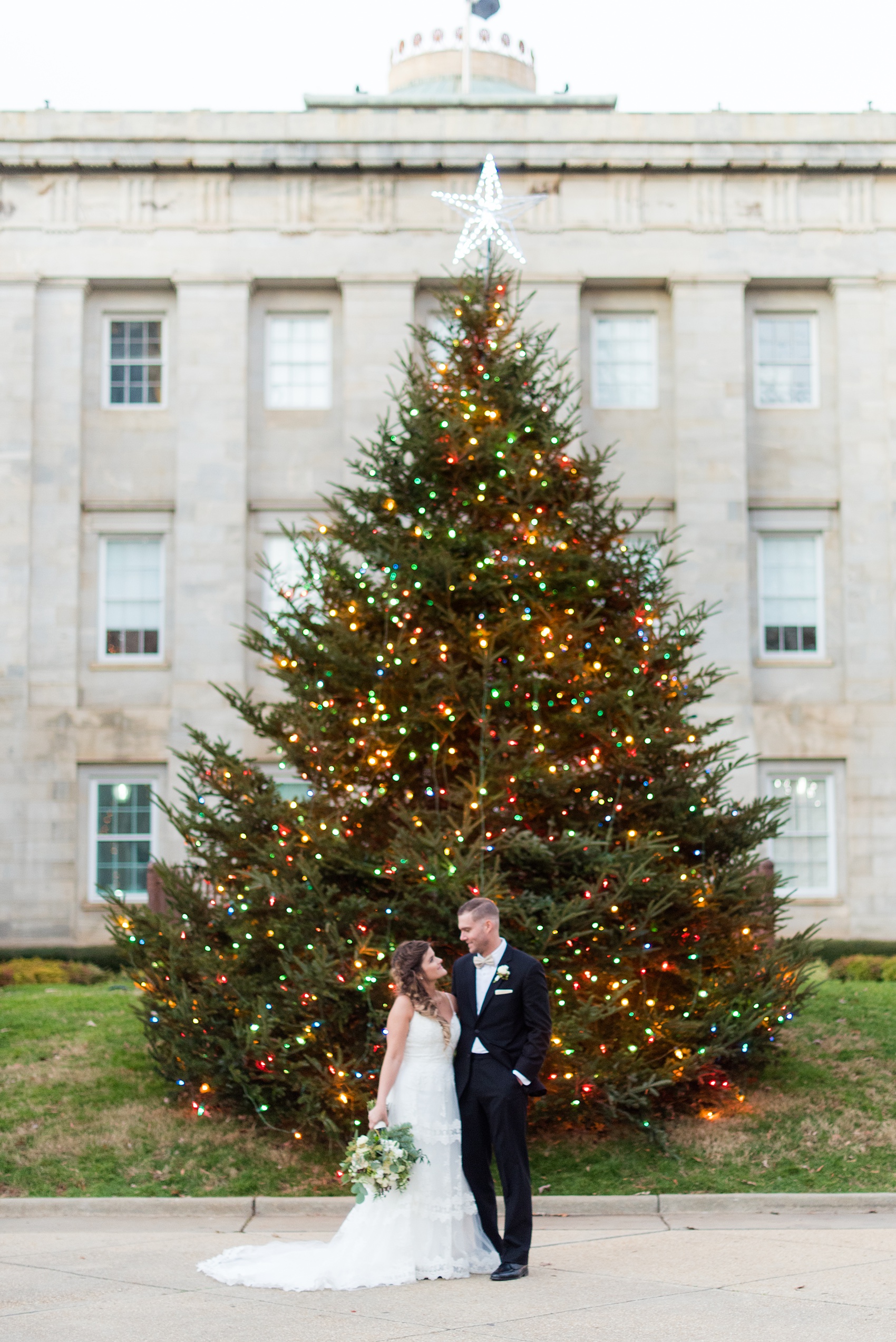 Downtown Raleigh wedding photographer Mikkel Paige Photography captures a December wedding, with evergreen and Christmas touches during the holidays. The reception was held at The Stockroom at 230 and getting ready at The Glass Box. #mikkelpaige #downtownraleighwedding #raleighweddingphotos #raleighweddingphotographer