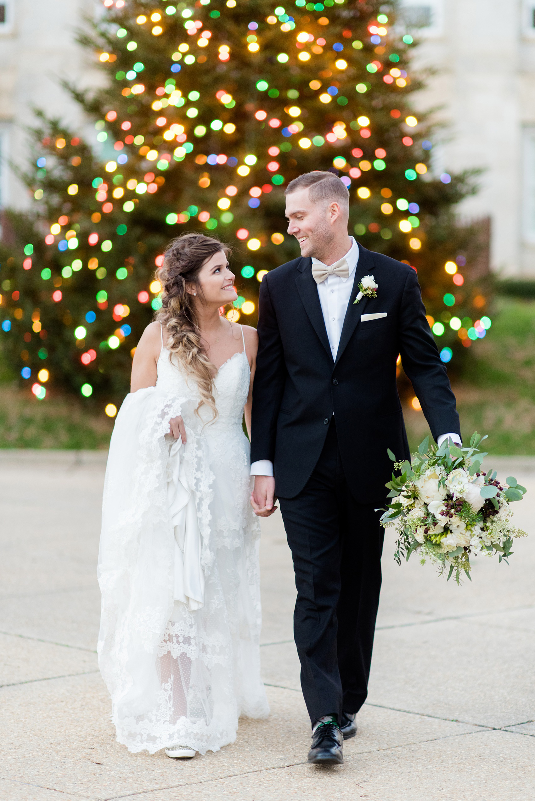 Downtown Raleigh wedding photographer Mikkel Paige Photography captures a December wedding, with evergreen and Christmas touches during the holidays. The reception was held at The Stockroom at 230 and getting ready at The Glass Box. #mikkelpaige #downtownraleighwedding #raleighweddingphotos #raleighweddingphotographer