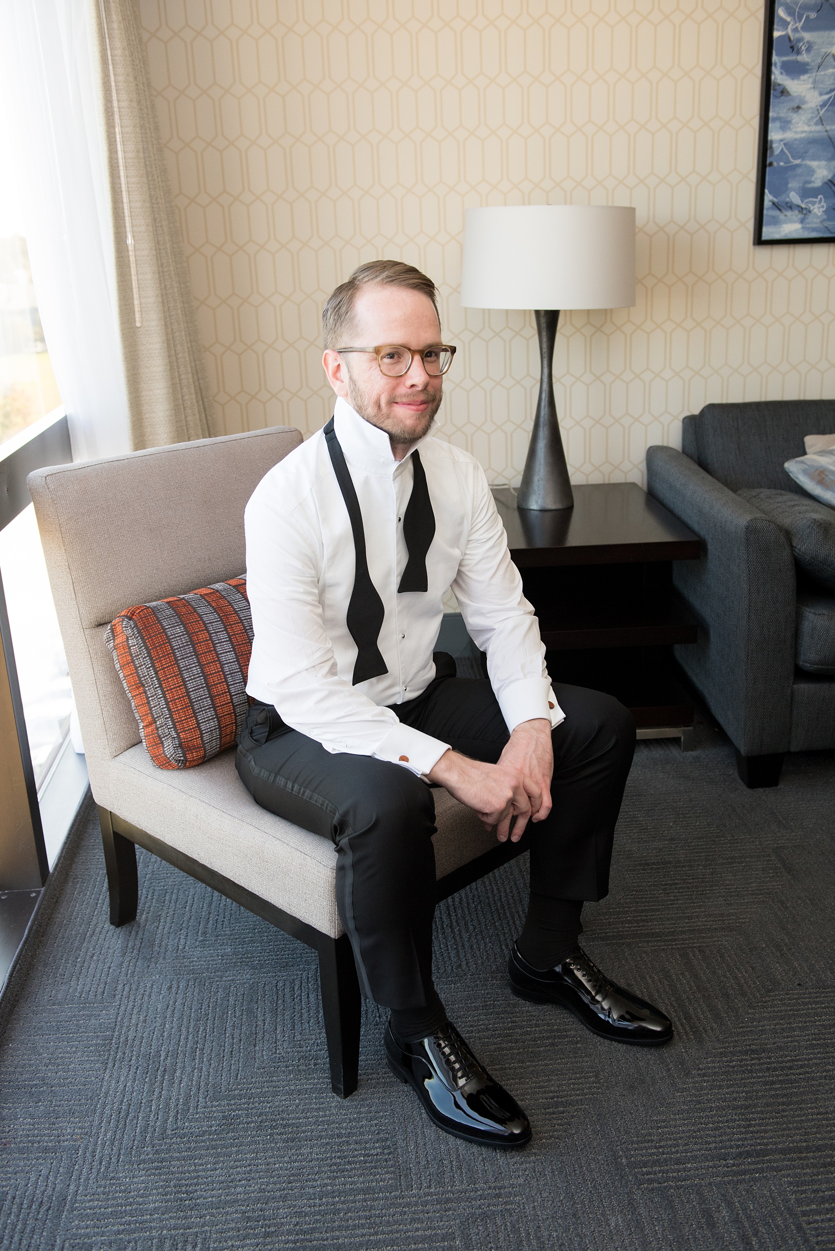 A fall wedding with burgundy, dusty rose and grey details. The groom got ready in a hotel room nearby and opened a special gift of Chicago cufflinks from his bride. Mikkel Paige Photography, photographer in Greenville NC and Raleigh captured this wedding at Rock Springs Center, planned by @vivalevent. Click through for more details and pictures from their day! #mikkelpaige #northcarolinawedding #southernwedding #gettingready #groomstyle #burgundywedding #chicagocufflinks #chicagogroom