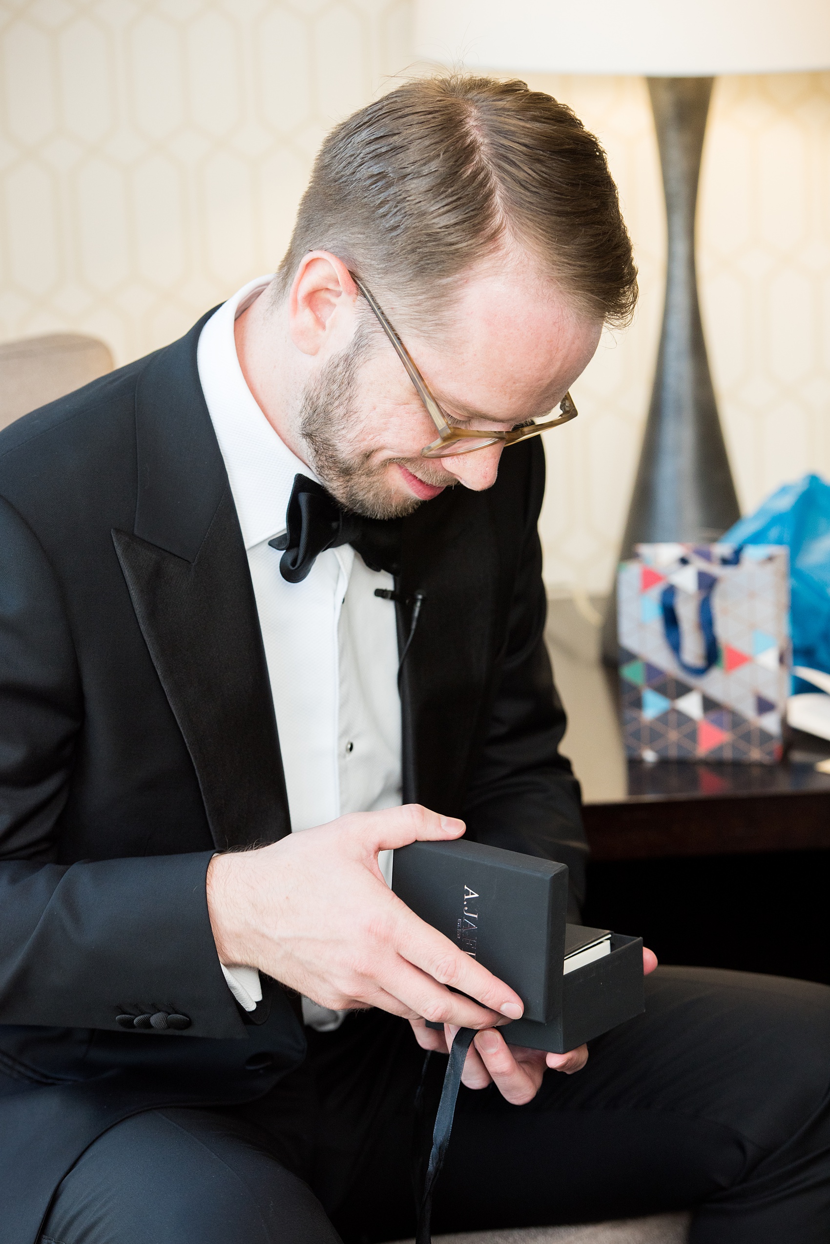 A fall wedding with burgundy, dusty rose and grey details. The groom got ready in a hotel room nearby and opened a special gift of Chicago cufflinks from his bride. Mikkel Paige Photography, photographer in Greenville NC and Raleigh captured this wedding at Rock Springs Center, planned by @vivalevent. Click through for more details and pictures from their day! #mikkelpaige #northcarolinawedding #southernwedding #gettingready #groomstyle #burgundywedding #chicagocufflinks #chicagogroom