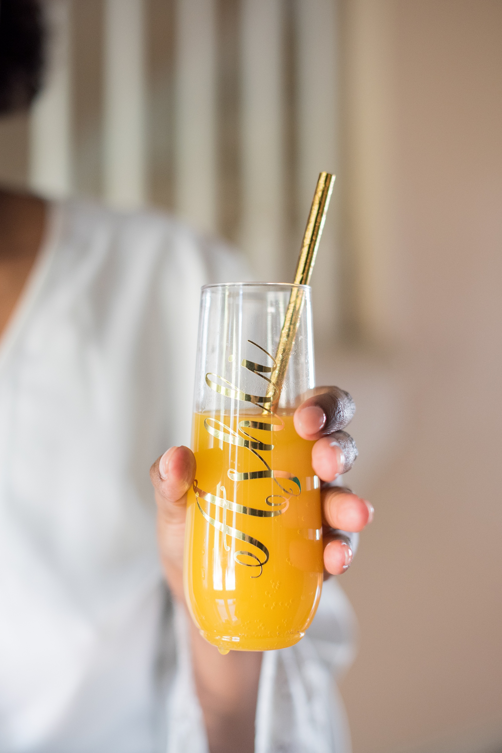 A fall wedding with burgundy, dusty rose and grey details. The bride got ready at her childhood home near the venue with her bridesmaids and mimosas in custom script stemless flutes. Mikkel Paige Photography, photographer in Greenville NC and Raleigh captured this wedding at Rock Springs Center, planned by @vivalevent. Click through for more details and cute pictures from their day! #mikkelpaige #northcarolinawedding #southernwedding #gettingready #burgundywedding #mimosas #champagneflutes