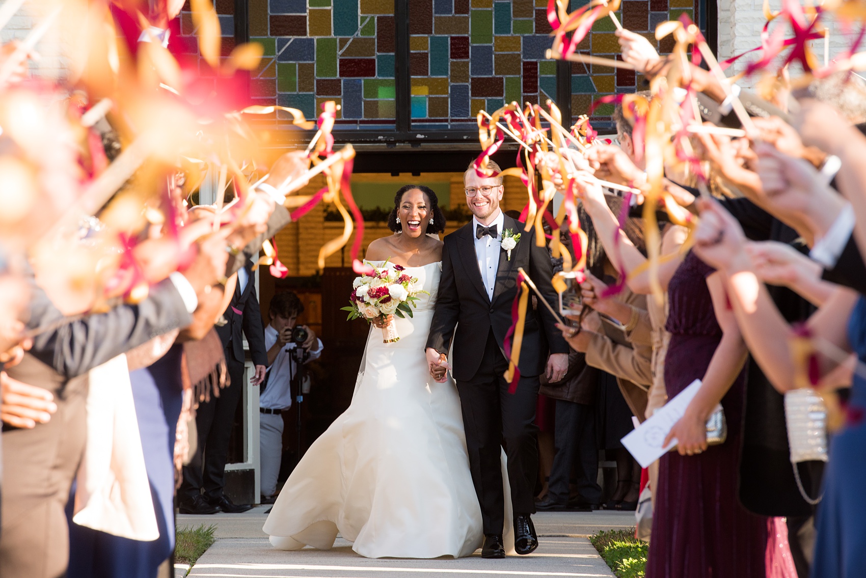 A fall wedding with burgundy, dusty rose and grey details. The bride and groom got married at the bride's childhood church and had a ribbon wand exit. Mikkel Paige Photography, photographer in Greenville NC and Raleigh captured this wedding at Rock Springs Center, planned by @vivalevent. Click through for more details and pictures from this autumn day! #mikkelpaige #northcarolinawedding #southernwedding #burgundywedding #churchceremony #ribbonexit