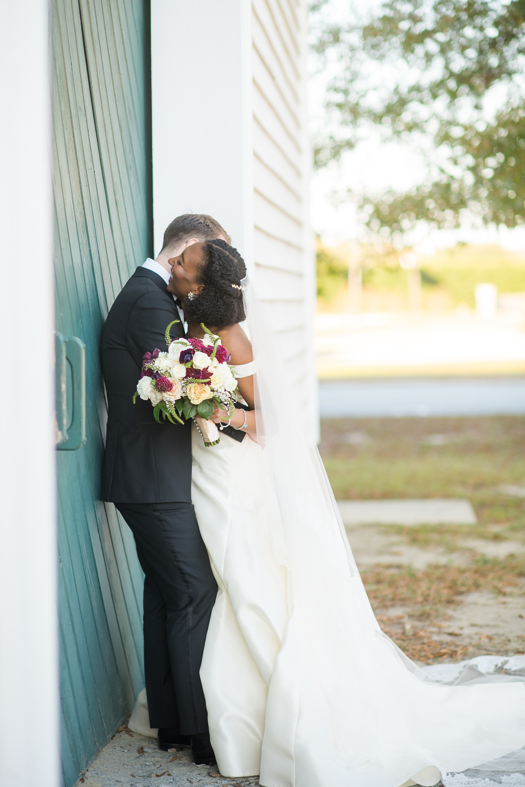 A fall wedding with burgundy, dusty rose and grey details. Mikkel Paige Photography, photographer in Greenville NC and Raleigh, captured this wedding at Rock Springs Center, planned by @vivalevent. The bride and groom had beautiful photos during golden hour on an autumn day! Click through for details! #mikkelpaige NCwedding #northcarolinawedding #southernwedding #brideandgroom