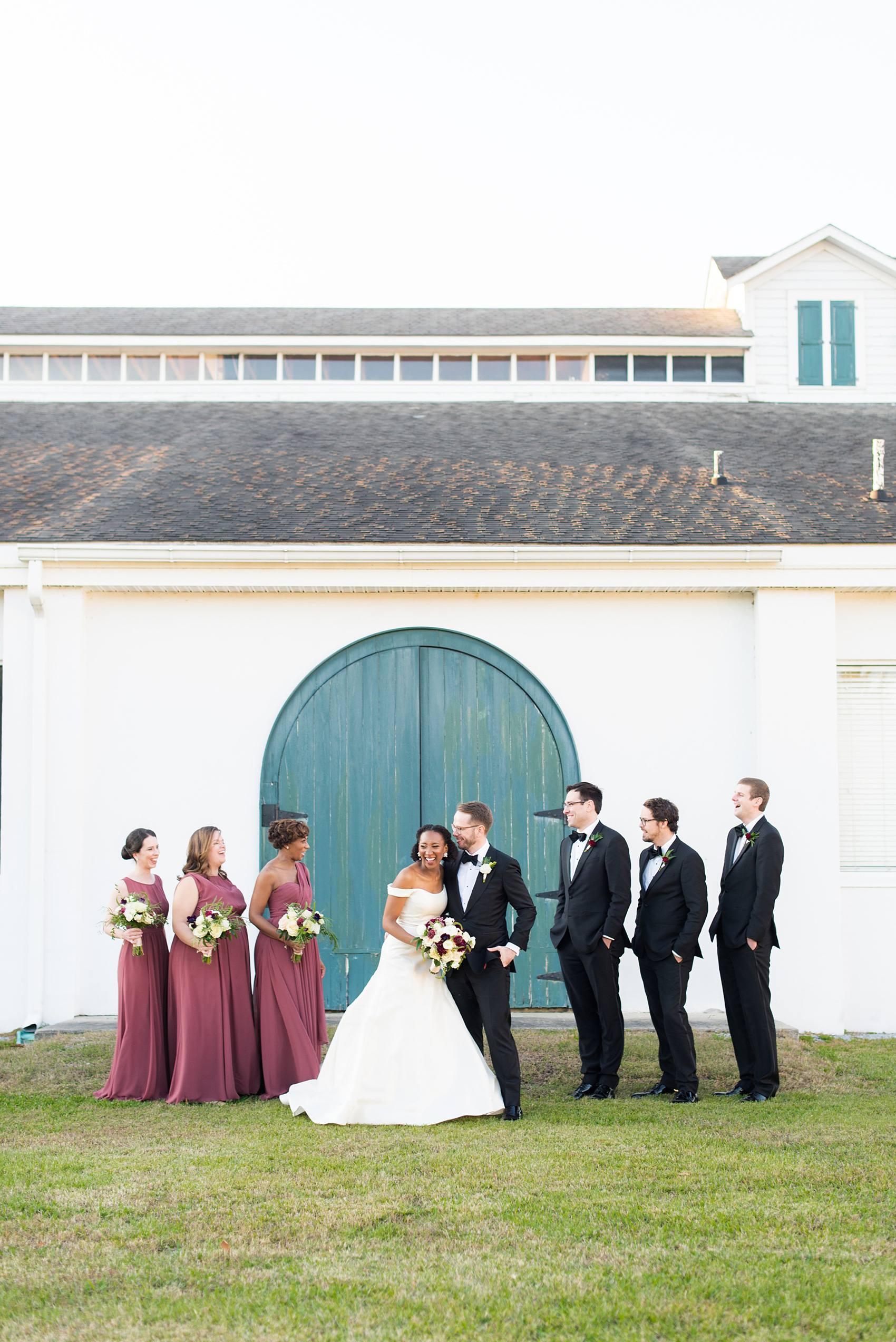 A fall wedding with burgundy, dusty rose and grey details. The bride and groom had three bridesmaids and groomsmen each, with the bridesmaids in cinnamon colored gowns and groomsmen in tuxedos. Mikkel Paige Photography, photographer in Greenville NC and Raleigh captured this wedding at Rock Springs Center, planned by @vivalevent. Click through for more details and pictures from this autumn celebration! #mikkelpaige #northcarolinawedding #southernwedding #bridesmaids#weddingparty #bridalparty 