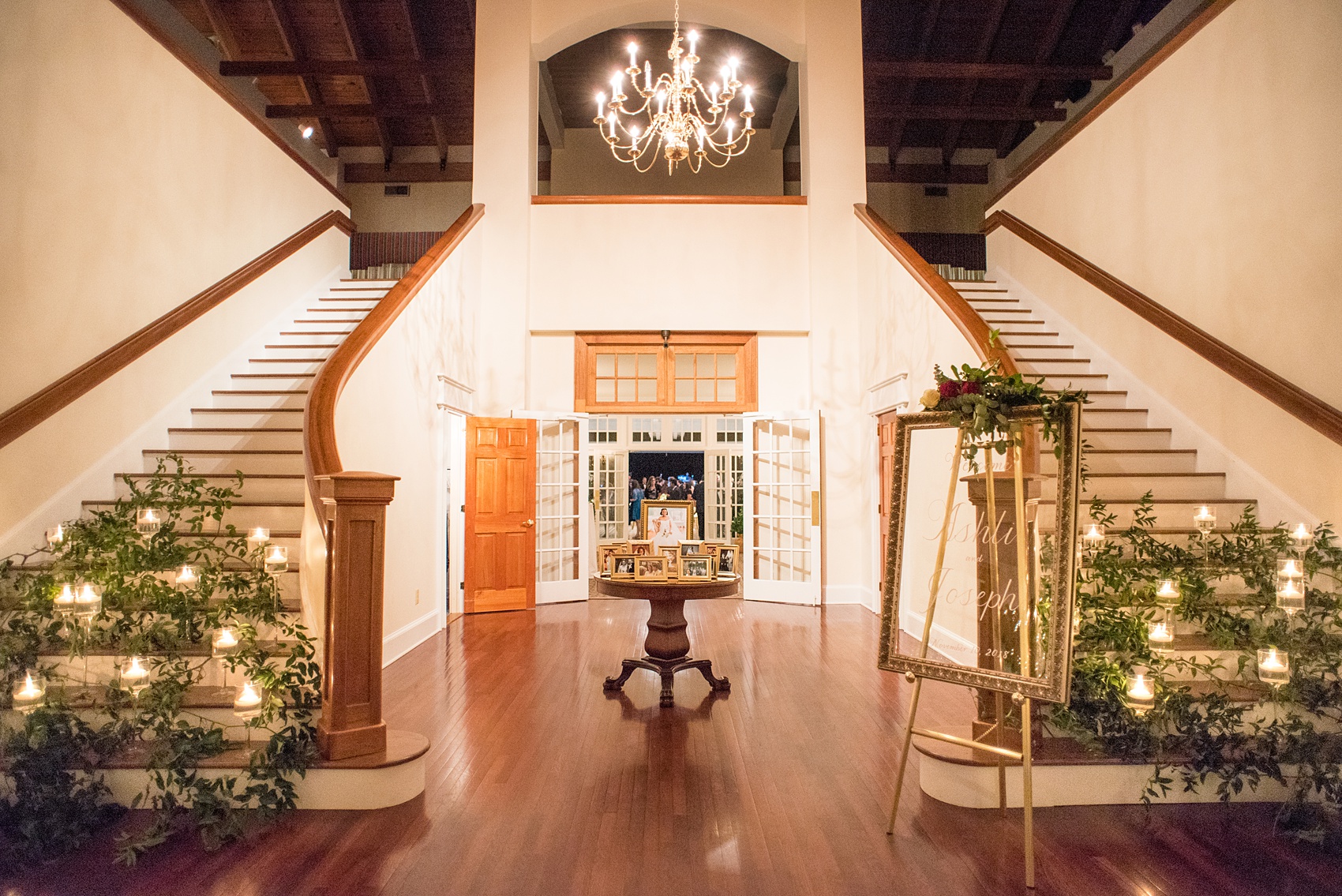 A fall wedding with burgundy, dusty rose and grey details. Candles and greenery lined the two staircases framing the reception room French doors when you walked into the venue. Mikkel Paige Photography, photographer in Greenville NC and Raleigh, captured this wedding at Rock Springs Center, planned by @vivalevent. Click through for more details and pictures from their day! #mikkelpaige #northcarolinawedding #southernwedding #weddingreception #burgundywedding #candlelight #prettystairs