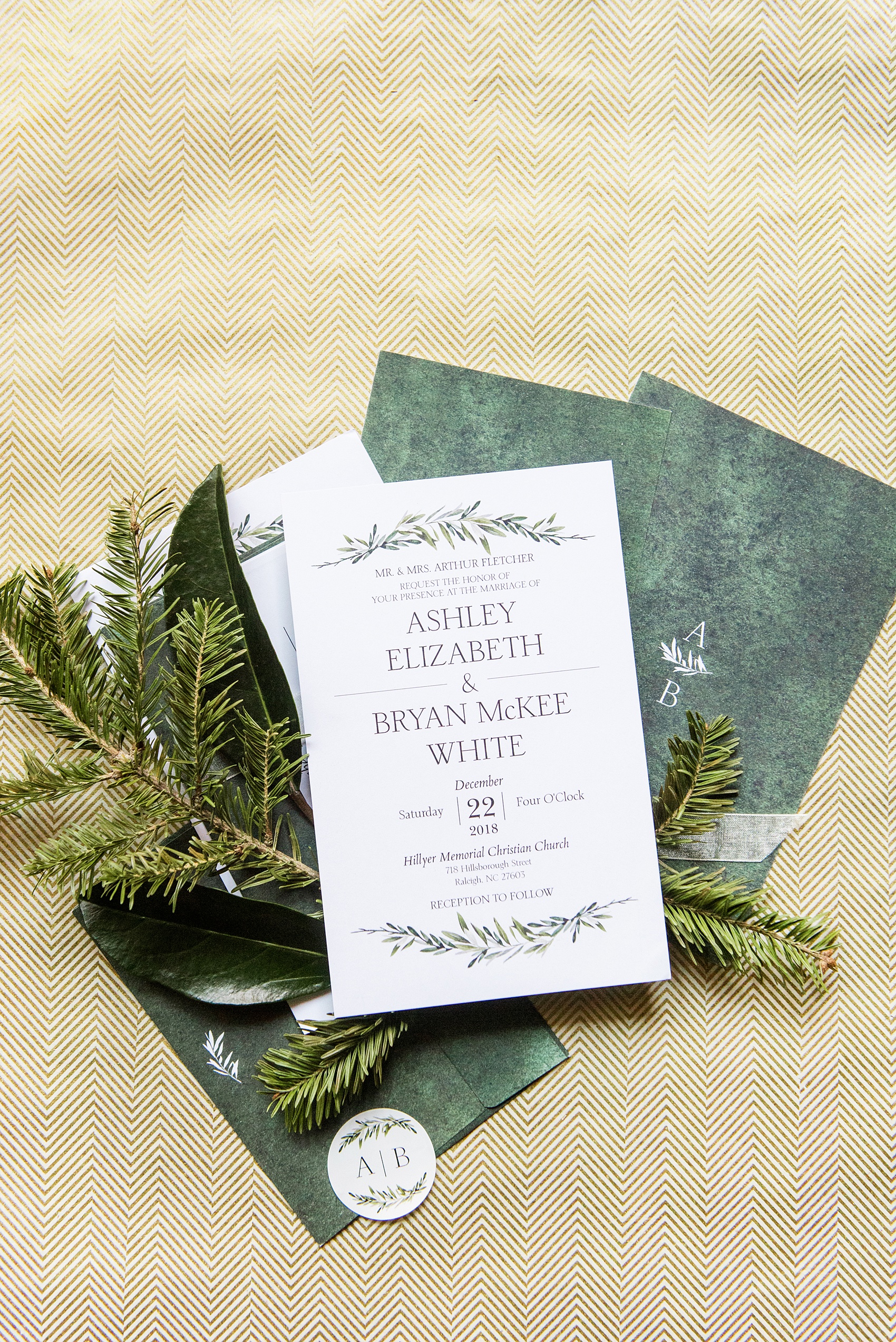 Pictures from a Christmas inspired wedding in downtown Raleigh, North Carolina by Mikkel Paige Photography. This bride and groom's holiday wedding will inspire you to consider December, with beautiful style, details and photos to wow you in a green and gold decor palette. Their invitation matched their color scheme and set the tone for the fun event. Click through for more! #mikkelpaige #raleighweddingphotographer #downtownRaleigh #christmaswedding #weddinginvitation