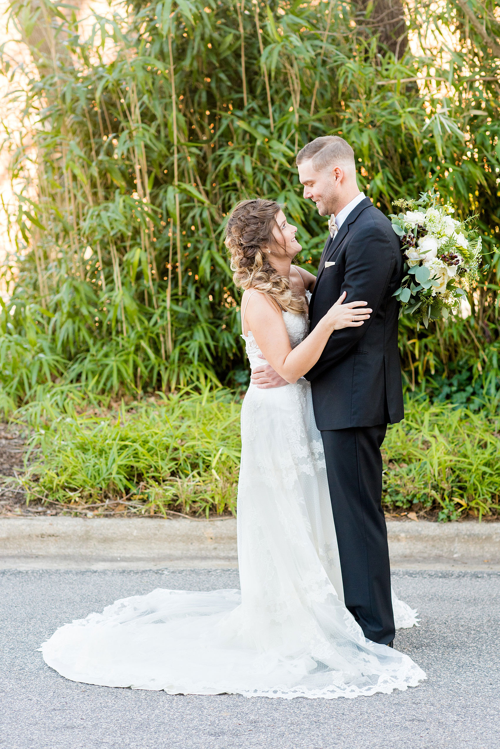 Pictures from a Christmas inspired wedding in downtown Raleigh, North Carolina by Mikkel Paige Photography. The bride and groom took outdoor portraits by their church before their reception at The Stockroom at 230. Click through for more ideas from their beautiful celebration, including details and decor photos in a green and gold decor palette. #mikkelpaige #raleighweddingphotographer #downtownRaleigh #christmaswedding #greenandgoldwedding #brideandgroom #bridal #holidaywedding #winterwedding