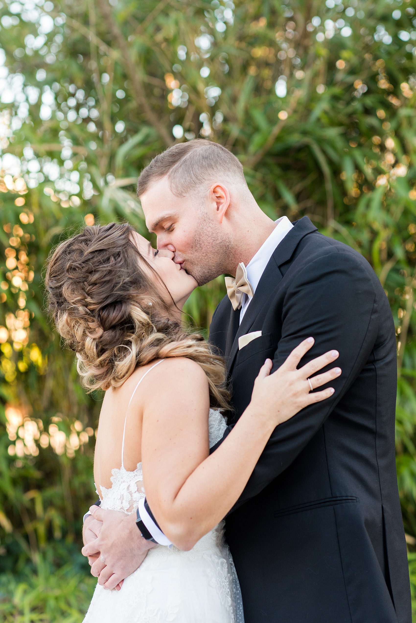 Pictures from a Christmas inspired wedding in downtown Raleigh, North Carolina by Mikkel Paige Photography. The bride and groom took outdoor portraits by their church before their reception at The Stockroom at 230. Click through for more ideas from their beautiful celebration, including details and decor photos in a green and gold decor palette. #mikkelpaige #raleighweddingphotographer #downtownRaleigh #christmaswedding #greenandgoldwedding #brideandgroom #bridal #holidaywedding #winterwedding