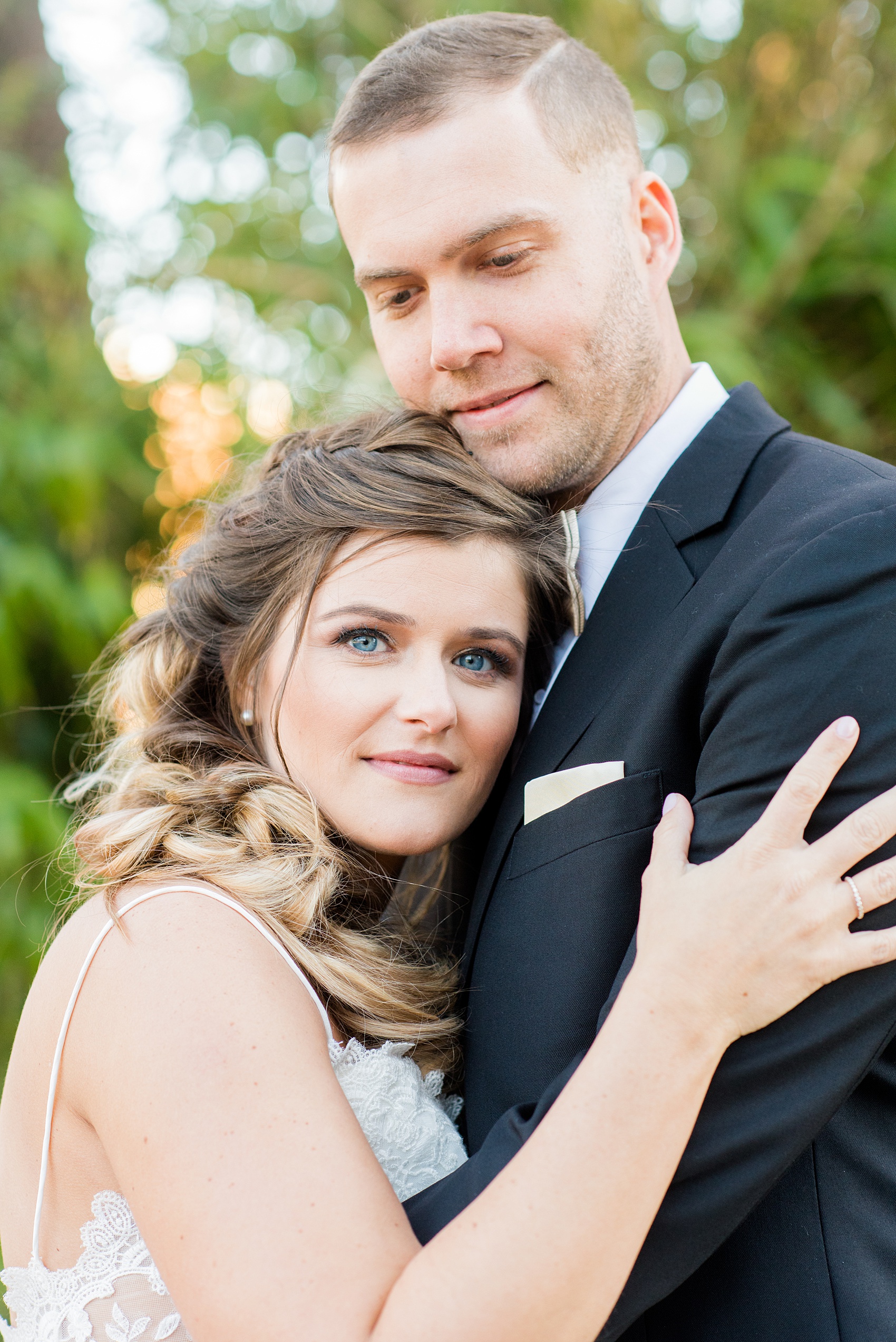 Pictures from a Christmas inspired wedding in downtown Raleigh, North Carolina by Mikkel Paige Photography. The bride and groom took outdoor portraits by their church. Click through for more ideas from their beautiful celebration, including details and decor photos in a green and gold decor palette for their reception. #mikkelpaige #raleighweddingphotographer #downtownRaleigh #christmaswedding #greenandgoldwedding #brideandgroom #bridal