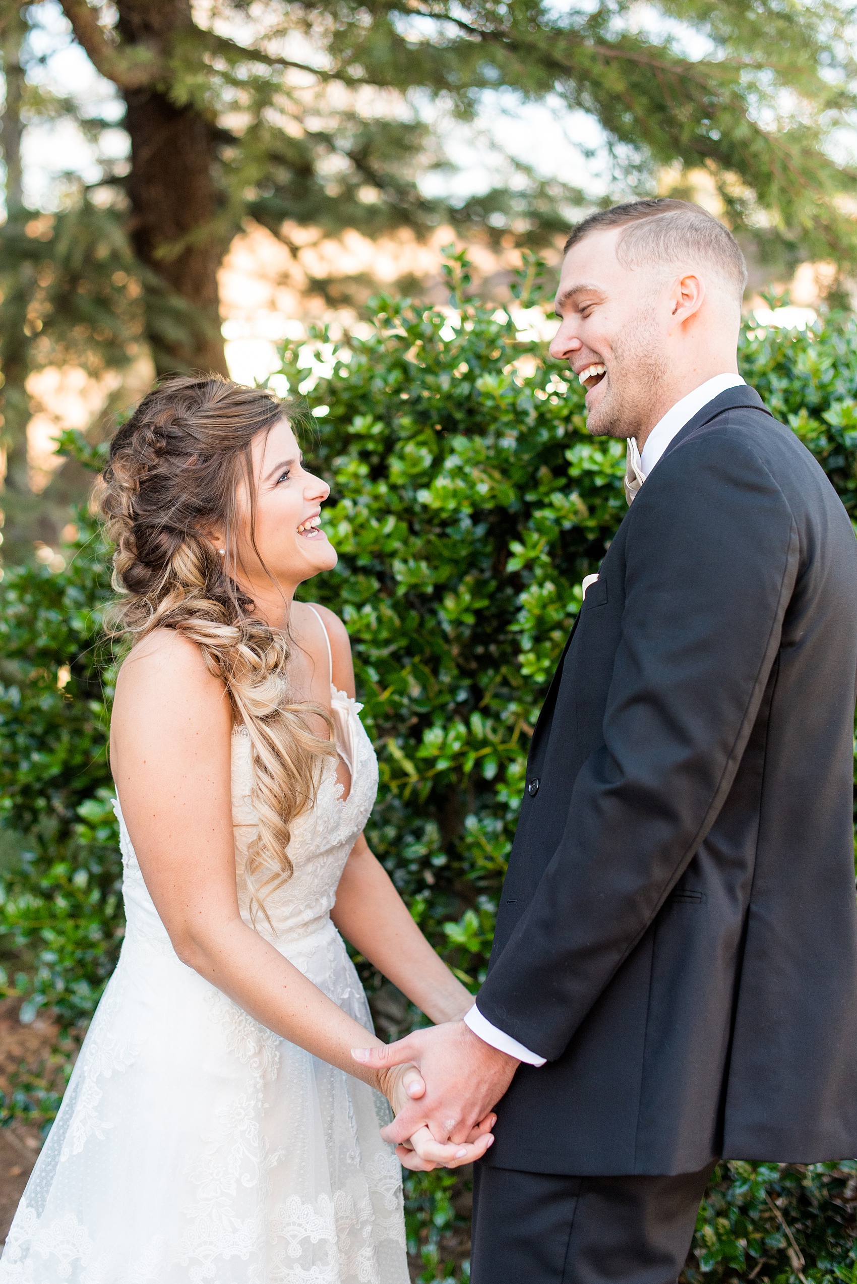 Pictures from a Christmas inspired wedding in downtown Raleigh, North Carolina by Mikkel Paige Photography. The bride and groom took outdoor portraits by their church. Click through for more ideas from their beautiful celebration, including details and decor photos in a green and gold decor palette for their reception. #mikkelpaige #raleighweddingphotographer #downtownRaleigh #christmaswedding #greenandgoldwedding #brideandgroom #bridal