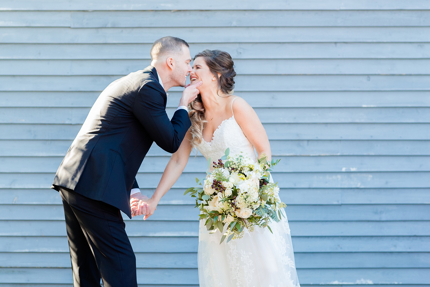 Pictures from a Christmas inspired wedding in downtown Raleigh, North Carolina by Mikkel Paige Photography. The bride and groom took outdoor portraits by their church. Click through for more ideas from their beautiful celebration, including details and decor photos in a green and gold decor palette for their reception. #mikkelpaige #raleighweddingphotographer #downtownRaleigh #christmaswedding #greenandgoldwedding #brideandgroom #bridal