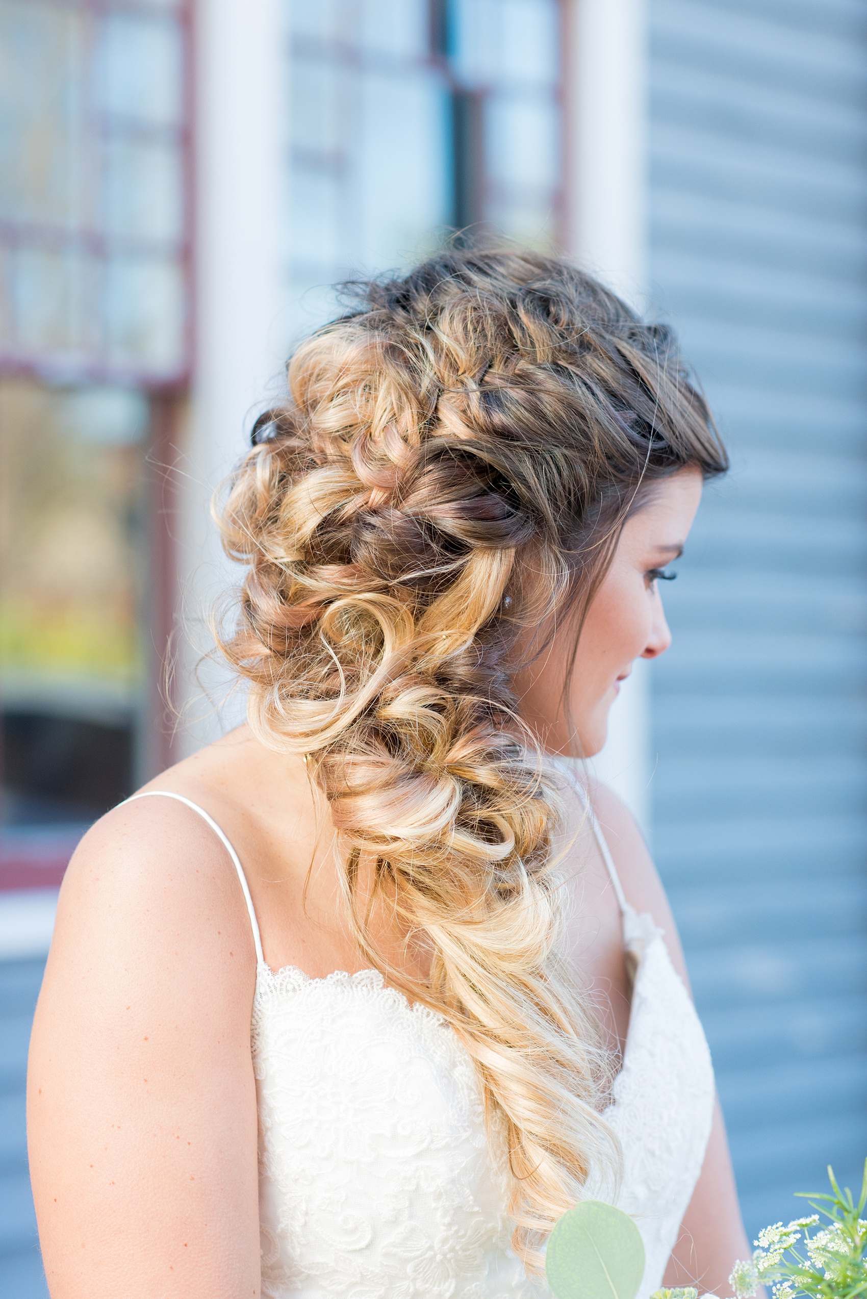 Pictures from a Christmas inspired wedding in downtown Raleigh, North Carolina by Mikkel Paige Photography. The bride took outdoor portraits by their church before their reception at The Stockroom at 230 and outdoors on The Glass Box. She wore a spaghetti strap gown and had a goddess braid hair style. Click through for more ideas from a beautiful celebration including details + decor photos. #mikkelpaige #raleighweddingphotographer #downtownRaleigh #greenandgoldwedding #bridestyle #goddesshair