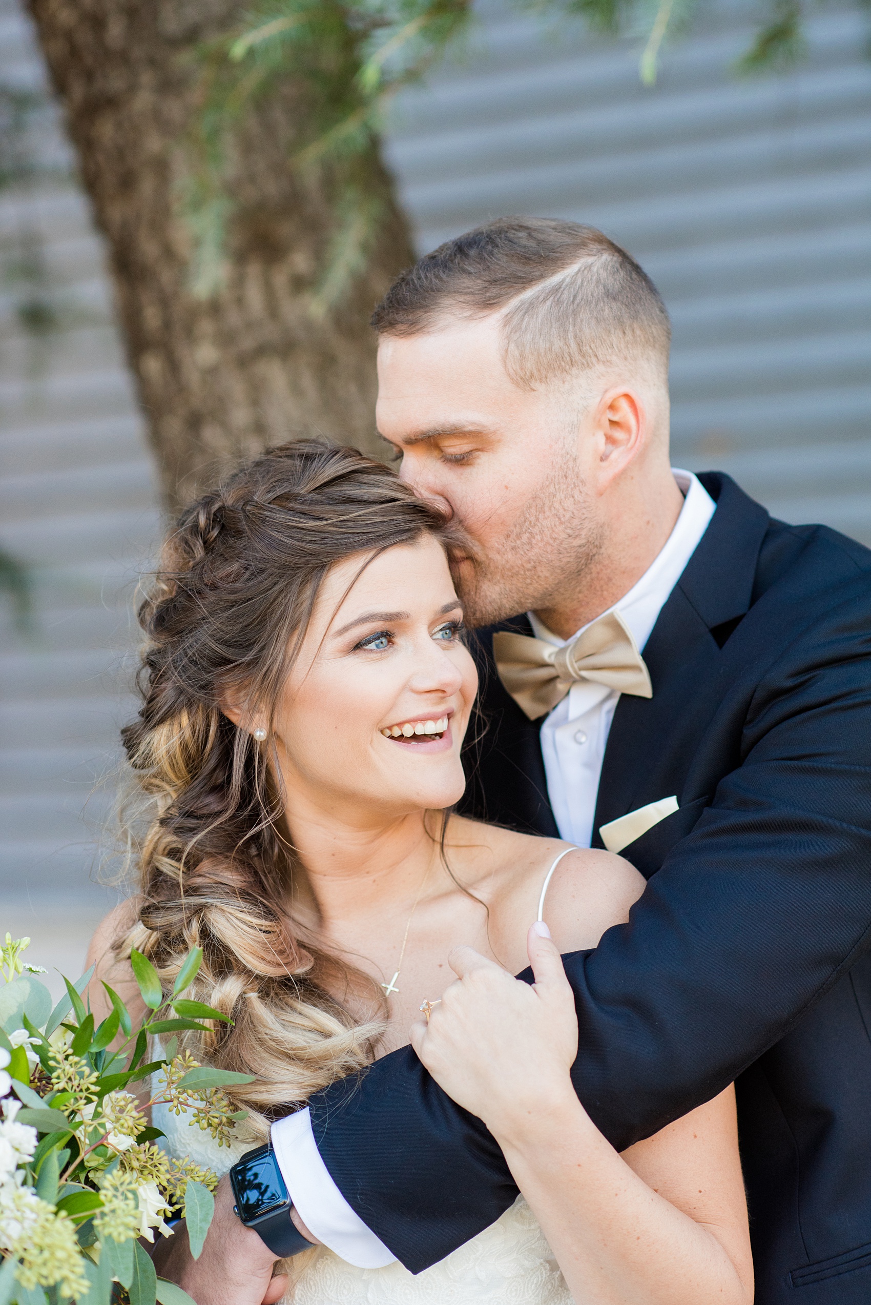 Pictures from a Christmas inspired wedding in downtown Raleigh, North Carolina by Mikkel Paige Photography. The bride and groom took outdoor portraits by their church. Click through for more ideas from their beautiful celebration, including details and decor photos in a green and gold decor palette for their reception. #mikkelpaige #raleighweddingphotographer #downtownRaleigh #christmaswedding #greenandgoldwedding #brideandgroom #bridal