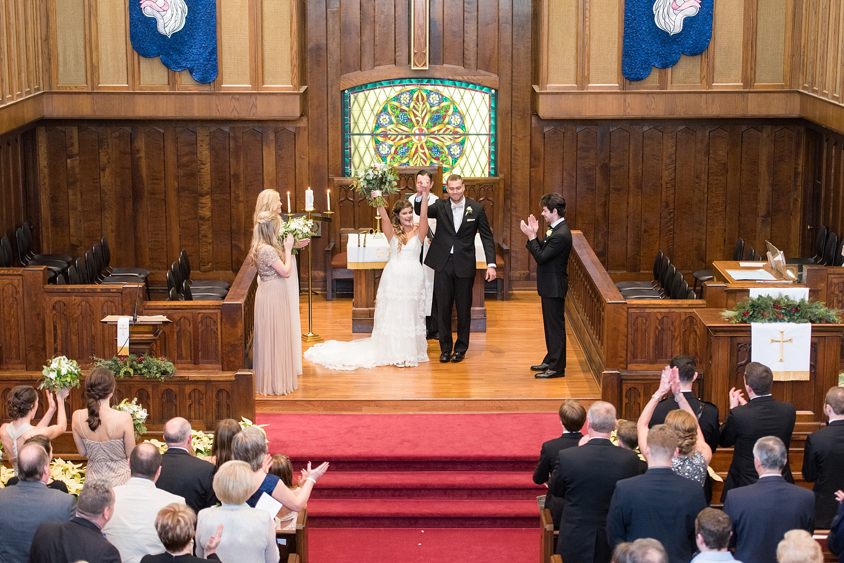 Pictures from a Christmas inspired wedding in downtown Raleigh, North Carolina by Mikkel Paige Photography. The couple's December ceremony was at a nearby Hillyer Memorial Christian Church and reception at The Stockroom at 230. Click through to see more ideas of their wedding party and pictures of the beautiful reception celebration, with a green and gold color palette. #mikkelpaige #raleighweddingphotographer #downtownRaleigh #weddingparty #winterwedding #greenandgoldwedding