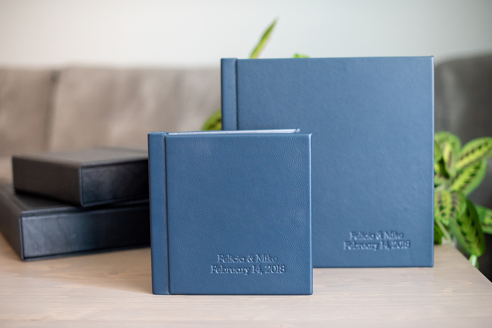 Photos from a winter wedding at Central Park Loeb Boathouse in NYC, by Mikkel Paige Photography, are beautifully displayed. The bride and groom chose a navy blue leather 12x12" album with spine and cover debossing to remember their day. #mikkelpaige #centralparkwedding #loebboathousewedding #NYCweddingphotographer #navyblueweddingalbum #parentalbums