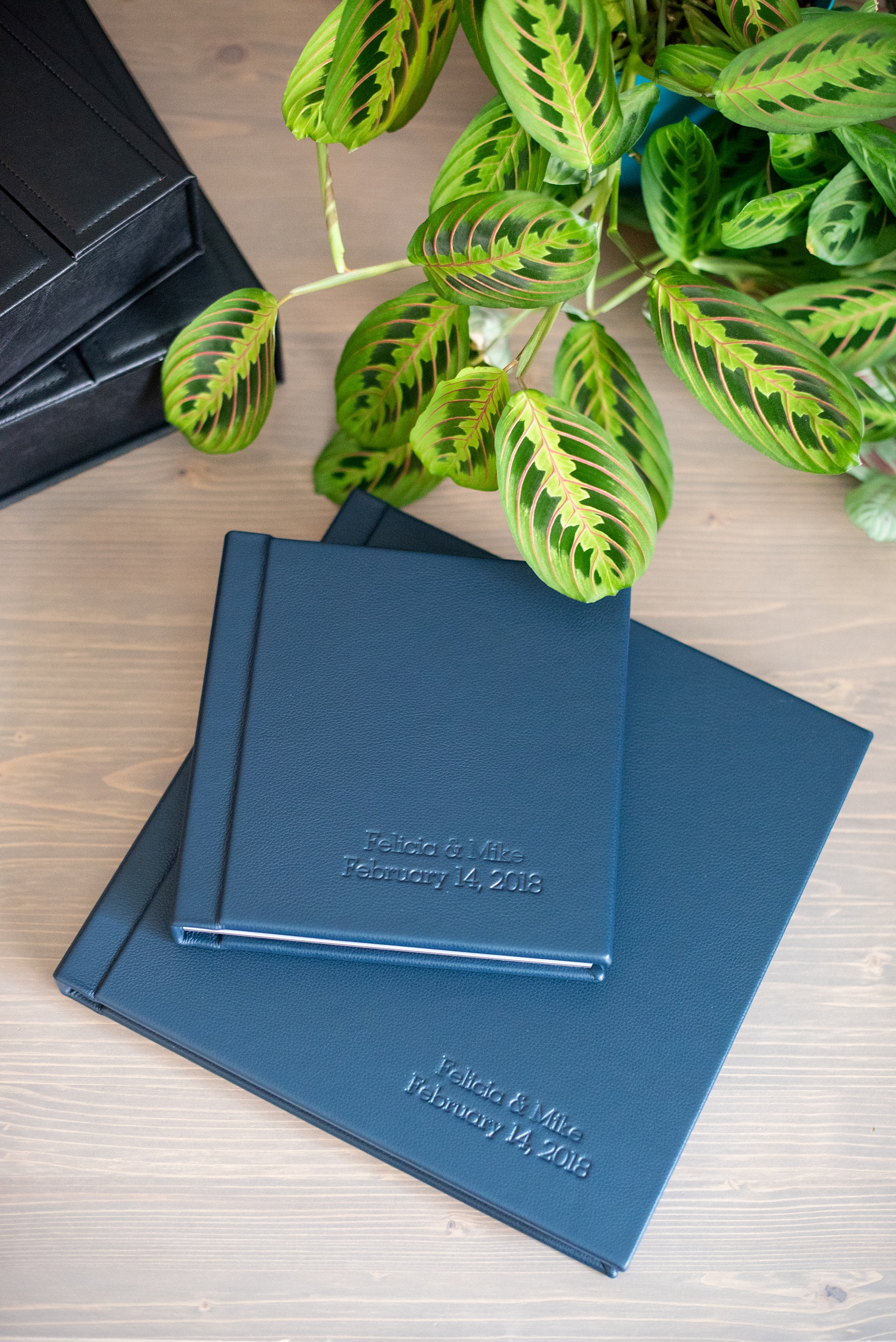 Photos from a winter wedding at Central Park Loeb Boathouse in NYC, by Mikkel Paige Photography, are beautifully displayed. The bride and groom chose a navy blue leather 12x12" album with spine and cover debossing to remember their day. #mikkelpaige #centralparkwedding #loebboathousewedding #NYCweddingphotographer #navyblueweddingalbum #parentalbums