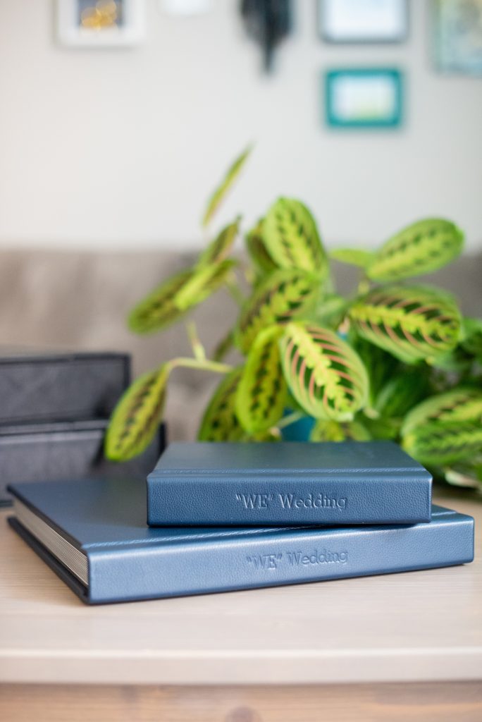 Photos from a winter wedding at Central Park Loeb Boathouse in NYC, by Mikkel Paige Photography, are beautifully displayed. The bride and groom chose a navy blue leather 12x12" album with spine and cover debossing to remember their day. #mikkelpaige #centralparkwedding #loebboathousewedding #NYCweddingphotographer #navyblueweddingalbum #parentalbums