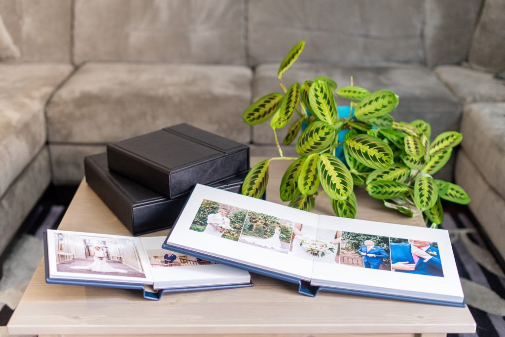 Photos from a winter wedding at Central Park Loeb Boathouse in NYC, by Mikkel Paige Photography, are beautifully displayed. The bride and groom chose a navy blue leather 12x12" album with spine and cover debossing to remember their day. #mikkelpaige #centralparkwedding #loebboathousewedding #NYCweddingphotographer #navyblueweddingalbum #parentalbums