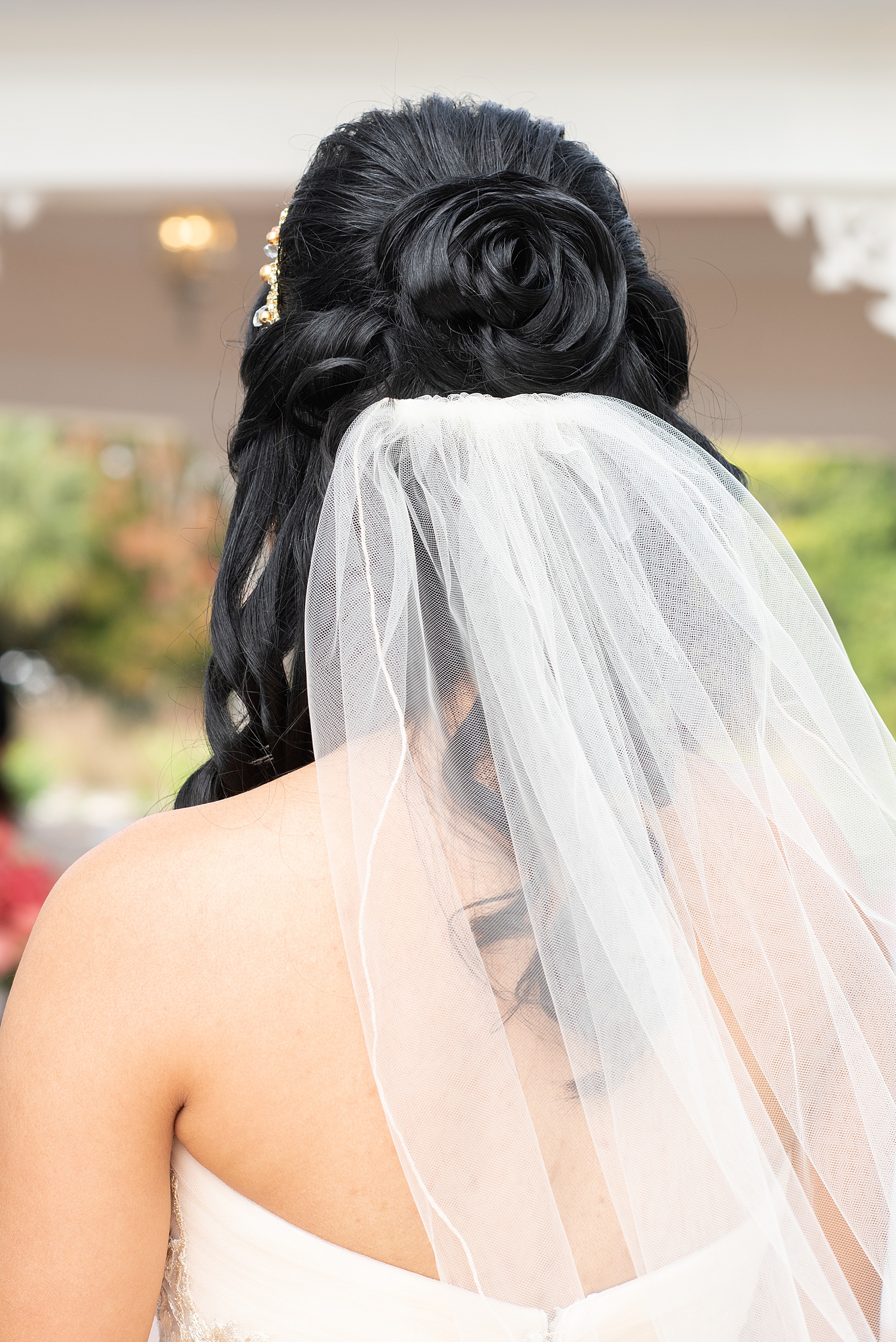 Photographs of a Walt Disney World bride by Mikkel Paige Photography. As a lover of Beauty and the Beast, the bride wove details from the classic Disney film into her wedding. Her beautiful rose embroidered dress was befitting of a princess. She got ready for her day at the dream resort, the Grand Floridian. Her hair was twisted into a fun, rose bun. #disneywedding #disneybride #waltdisneyworld #DisneyWorldWedding