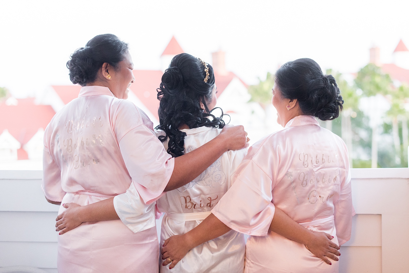 Photographs of a Walt Disney World wedding by Mikkel Paige Photography. The bride and groom got ready for their small wedding pavilion ceremony at the Grand Floridian, took photos at the garden and with the castle and went to their awesome reception at the Contemporary resort. This beautiful December wedding will give you ideas for a fun celebration outside of the parks. #disneywedding #disneybride #waltdisneyworld #DisneyWorldWedding #GrandFloridianResort