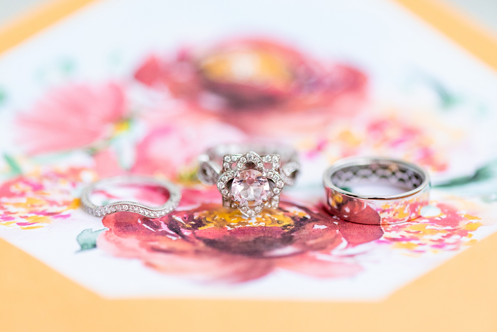 Photographs of a Walt Disney World wedding by Mikkel Paige Photography. The bride’s engagement ring was themed to Beauty and the Beast with a pink morganite center stone. It perfectly matched their invitations with Cinderella Castle as the main watercolor and the movie glass rose dome on the RSVP card. #disneywedding #disneybride #waltdisneyworld #DisneyWorldWedding #morganitering #pinkengagementring #rosering #BeautyandtheBeast