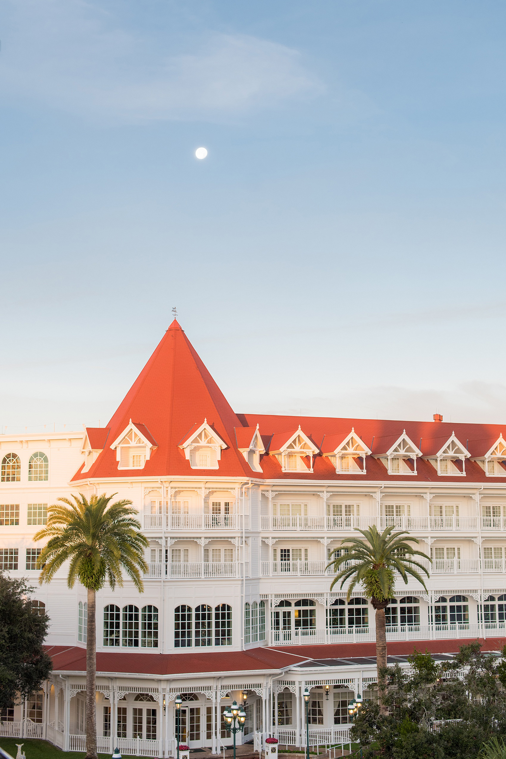 Photographs of a Walt Disney World wedding by Mikkel Paige Photography. The bride and groom got ready for their small wedding pavilion ceremony at the Grand Floridian, took photos at the garden and with the castle and went to their awesome reception at the Contemporary resort. This beautiful December wedding will give you ideas for a fun celebration outside of the parks. #disneywedding #disneybride #waltdisneyworld #DisneyWorldWedding #GrandFloridianResort