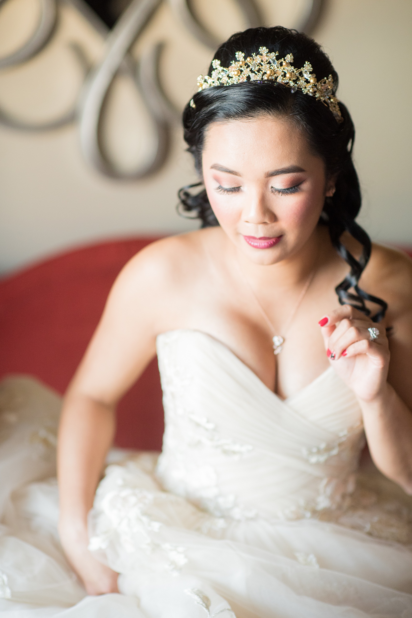 Photographs of a Walt Disney World bride by Mikkel Paige Photography. As a lover of Beauty and the Beast, the bride wove details from the classic Disney film into her wedding. Her beautiful rose embroidered dress was befitting of a princess. She got ready for her day at the dream resort, the Grand Floridian. Her hair was twisted into a fun, rose bun. #disneywedding #disneybride #waltdisneyworld #DisneyWorldWedding