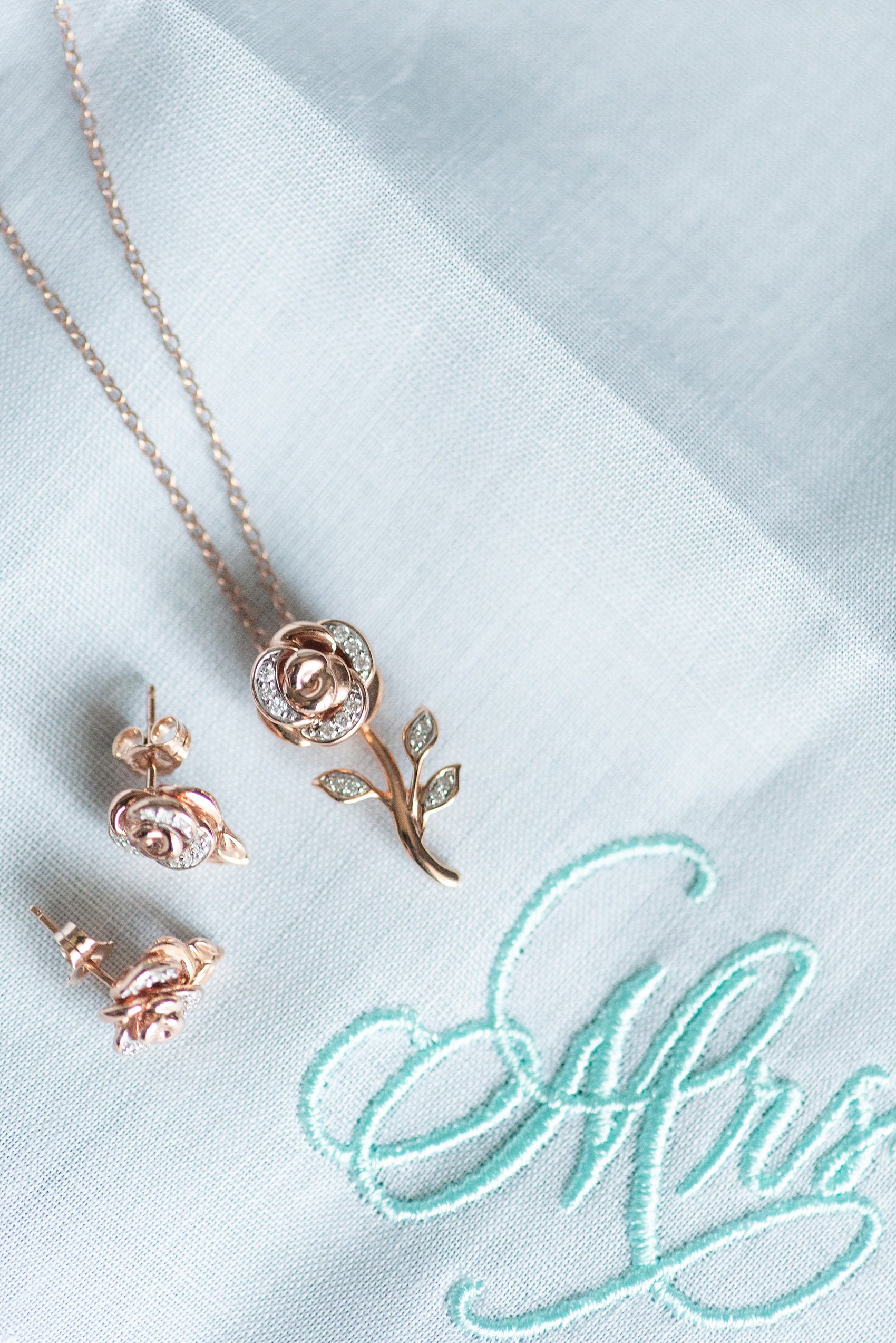 Photographs of a Walt Disney World wedding by Mikkel Paige Photography. The bride got ready at the Grand Floridian and had rose gold Beauty and the Beast jewelry, worthy of a princess! #disneywedding #disneybride #waltdisneyworld #DisneyWorldWedding #BeautyandtheBeast #rosegold