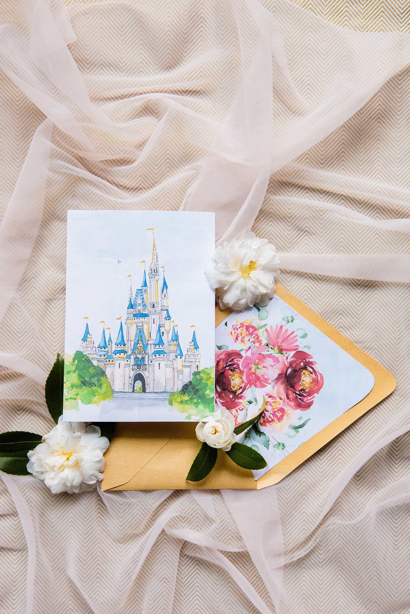 Photographs of a Walt Disney World wedding by Mikkel Paige Photography will give you ideas for a tasteful Beauty and the Beast theme. The awesome invitation had a custom watercolor by Watercolor Design Studio of the couple’s dog, Cinderella’s castle, and the Seven Seas Lagoon. The bride and groom managed beautiful details for their dream ceremony and reception even on a small budget. #disneywedding #disneybride #waltdisneyworld #DisneyWorldWedding #watercolorinvitation #disneyillustration