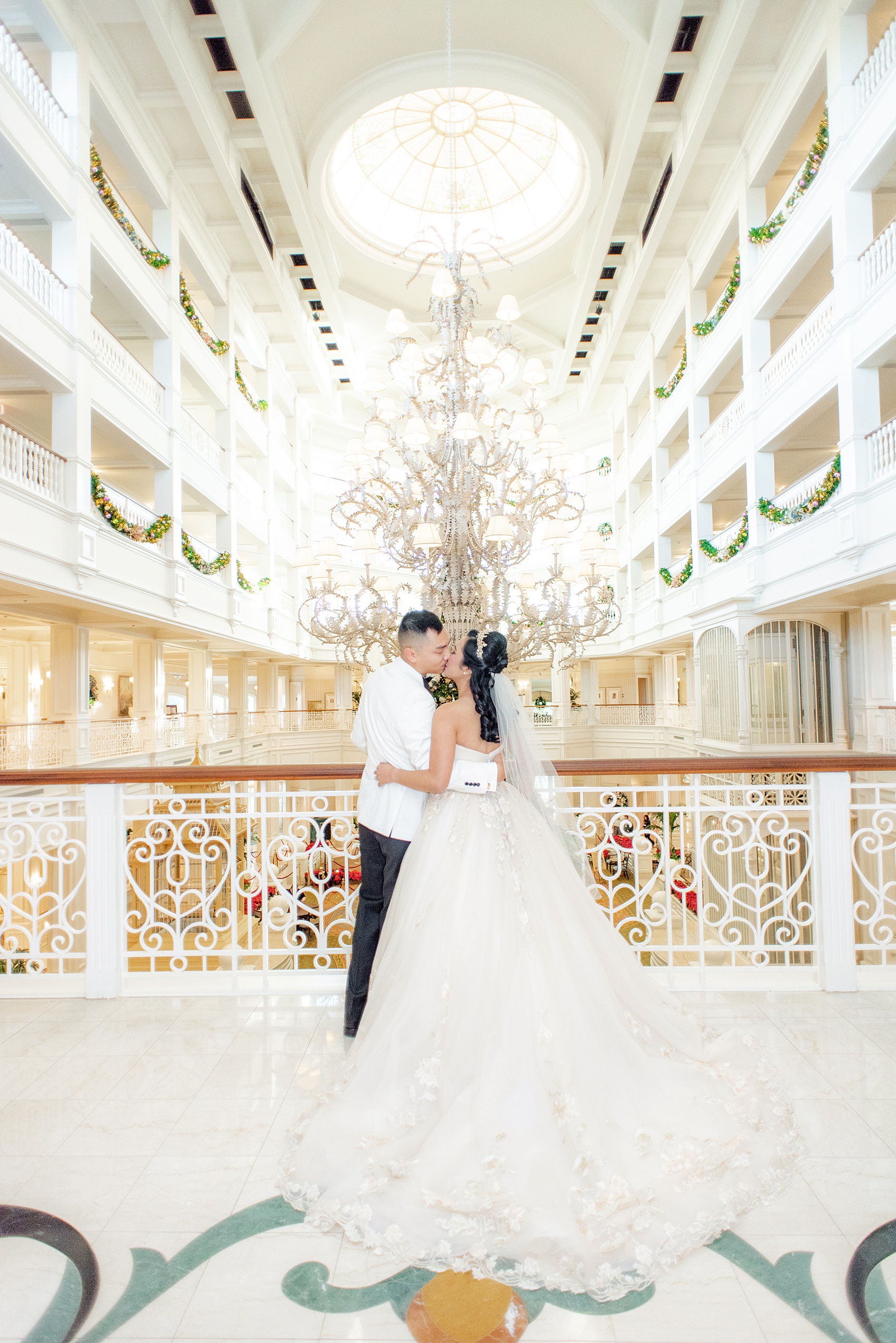 Photographs of a Walt Disney World bride by Mikkel Paige Photography. As a lover of Beauty and the Beast, the bride wove details from the classic Disney film into her wedding. Her beautiful rose embroidered dress was befitting of a princess. She got ready for her day at the dream resort, the Grand Floridian. Her hair was twisted into a fun, rose bun. #disneywedding #disneybride #waltdisneyworld #DisneyWorldWedding