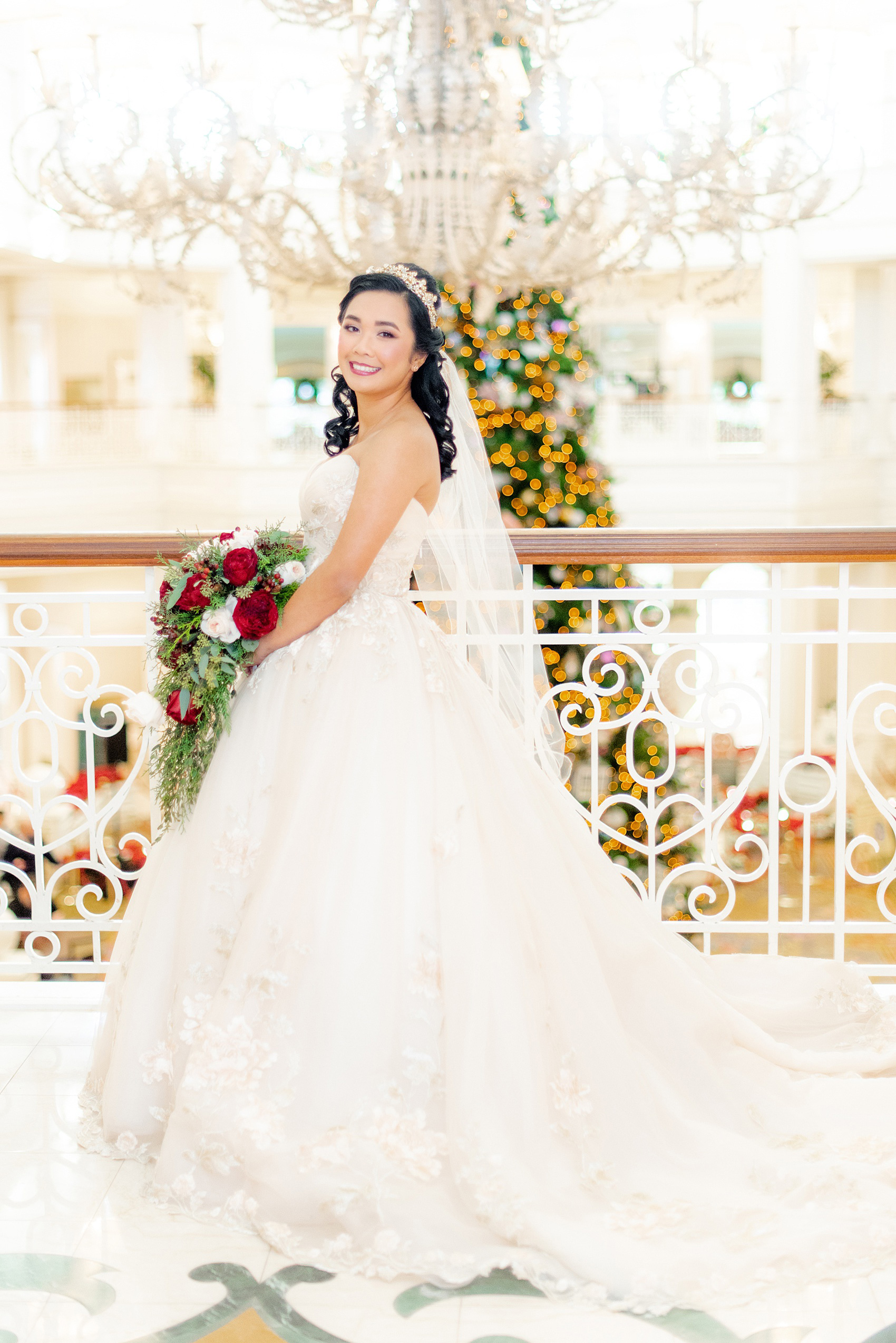 Photographs of a Walt Disney World bride by Mikkel Paige Photography. As a lover of Beauty and the Beast, the bride wove details from the classic Disney film into her wedding. Her beautiful rose embroidered dress was befitting of a princess. She got ready for her day at the dream resort, the Grand Floridian. Her hair was twisted into a fun, rose bun. #disneywedding #disneybride #waltdisneyworld #DisneyWorldWedding