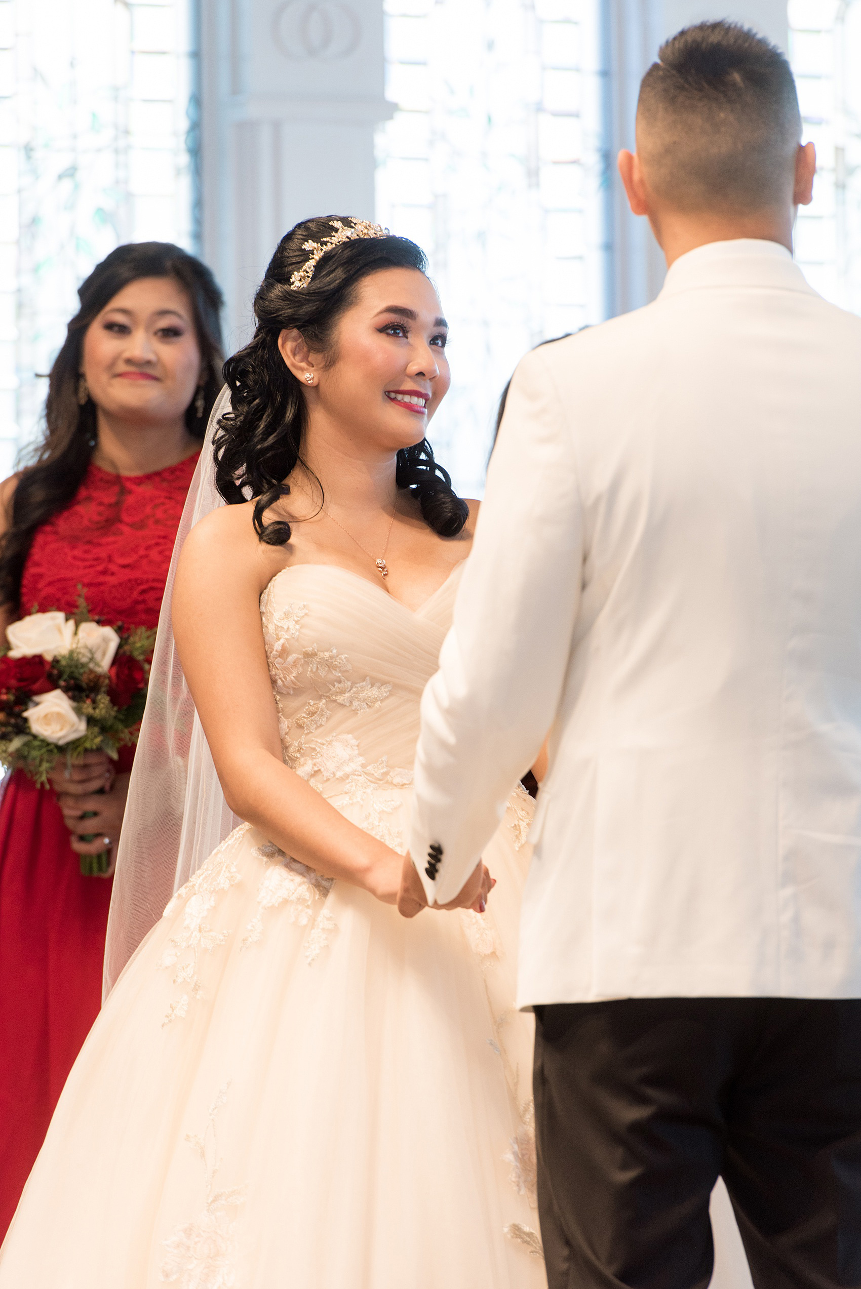 Photographs of a Walt Disney World wedding by Mikkel Paige Photography will give you ideas for a tasteful Beauty and the Beast theme. There was a glass dome with a red rose inside at the start of the ceremony with red rose petals scattered down the aisle for a small, intimate guest list at the Wedding Pavilion next to the Grand Floridian resort. #disneywedding #disneybride #waltdisneyworld #DisneyWorldWedding #DisneyCeremony #DisneyWorldWeddingPavilion