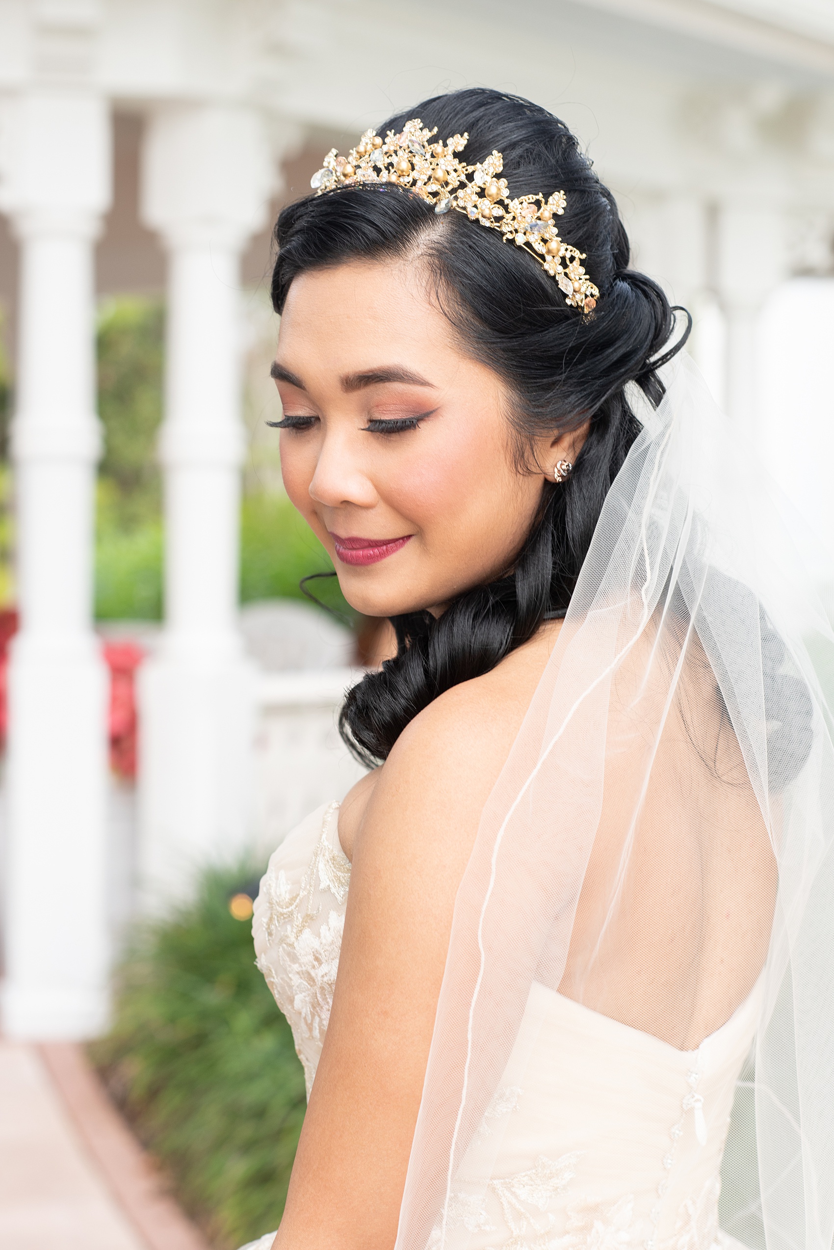 Photographs of a Walt Disney World bride by Mikkel Paige Photography. As a lover of Beauty and the Beast, the bride wove details from the classic Disney film into her wedding. Her beautiful rose embroidered dress was befitting of a princess. She got ready for her day at the dream resort, the Grand Floridian. Her hair was twisted into a fun, rose bun. #disneywedding #disneybride #waltdisneyworld #DisneyWorldWedding