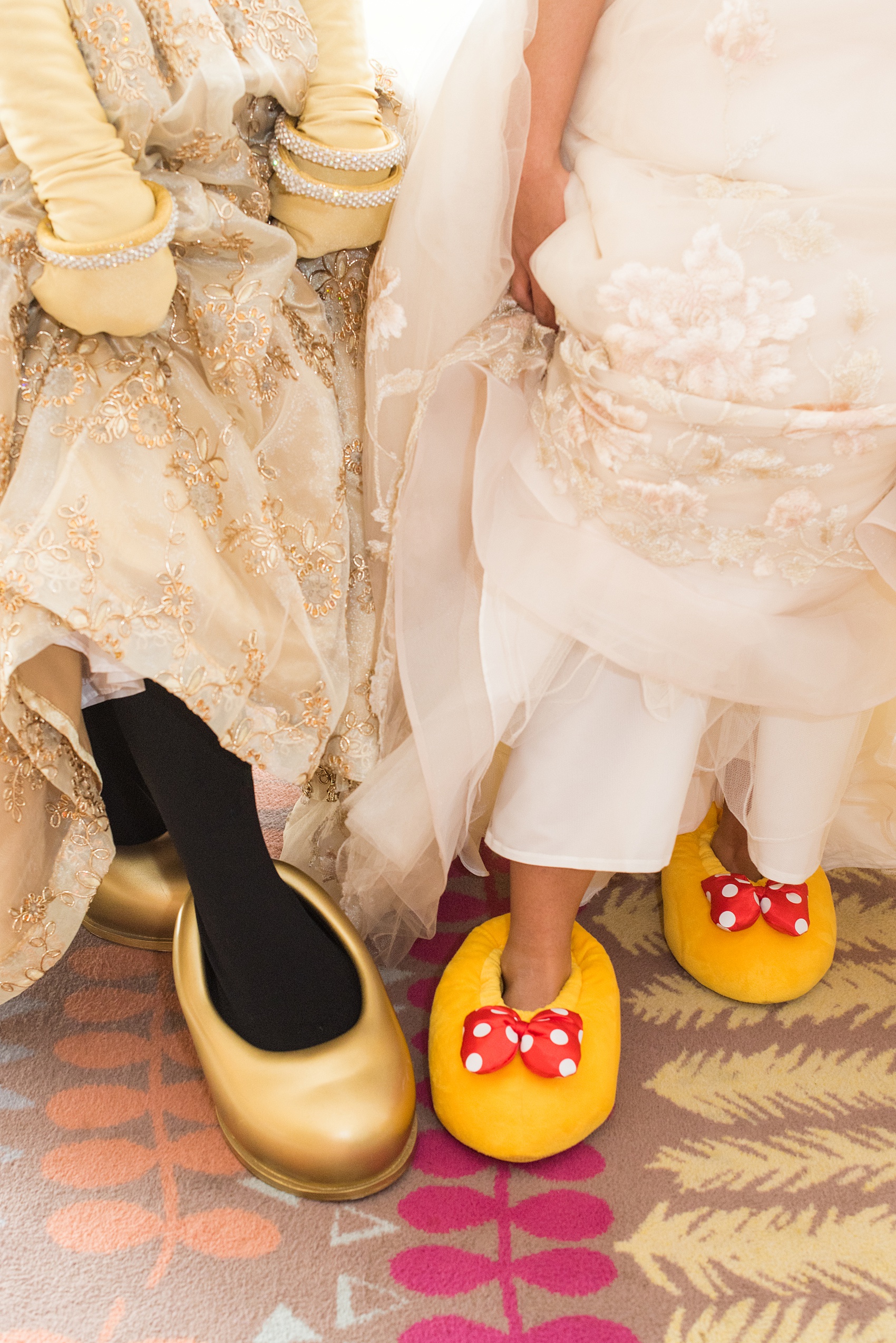 Photographs of a Walt Disney World wedding by Mikkel Paige Photography. The bride wore matching Minnie Mouse slippers to get ready and their photographer had the idea to do a cute Minnie Mouse and Bride matching shoe picture! The reception venue at The Contemporary Resort’s California Grill was great for fun, awesome photos with them. Their small, dream day overlooked the Magic Kingdom Park and Cinderella Castle! #disneywedding #DisneyWorldWedding #MinnieMouse