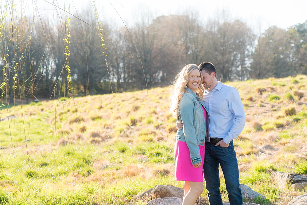 Beautiful pictures of an engagement session at the North Carolina Museum of Art, NCMA by Raleigh North Carolina wedding photographer, Mikkel Paige Photography. They brought their Golden Doodle dog for extra fun and we captured the Cherry Blossoms during a spring photoshoot. | Raleigh Engagement Photographer | #mikkelpaige #RaleighEngagementPhotographer #RaleighEngagementPhotographs