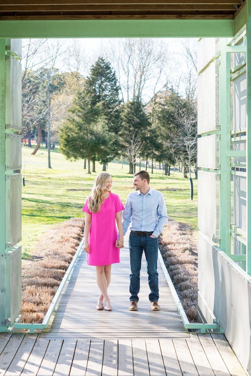 Beautiful pictures of an engagement session at the North Carolina Museum of Art, NCMA by Raleigh North Carolina wedding photographer, Mikkel Paige Photography. They brought their Golden Doodle dog for extra fun and we captured the Cherry Blossoms during a spring photoshoot. | Raleigh Engagement Photographer | #mikkelpaige #RaleighEngagementPhotographer #RaleighEngagementPhotographs